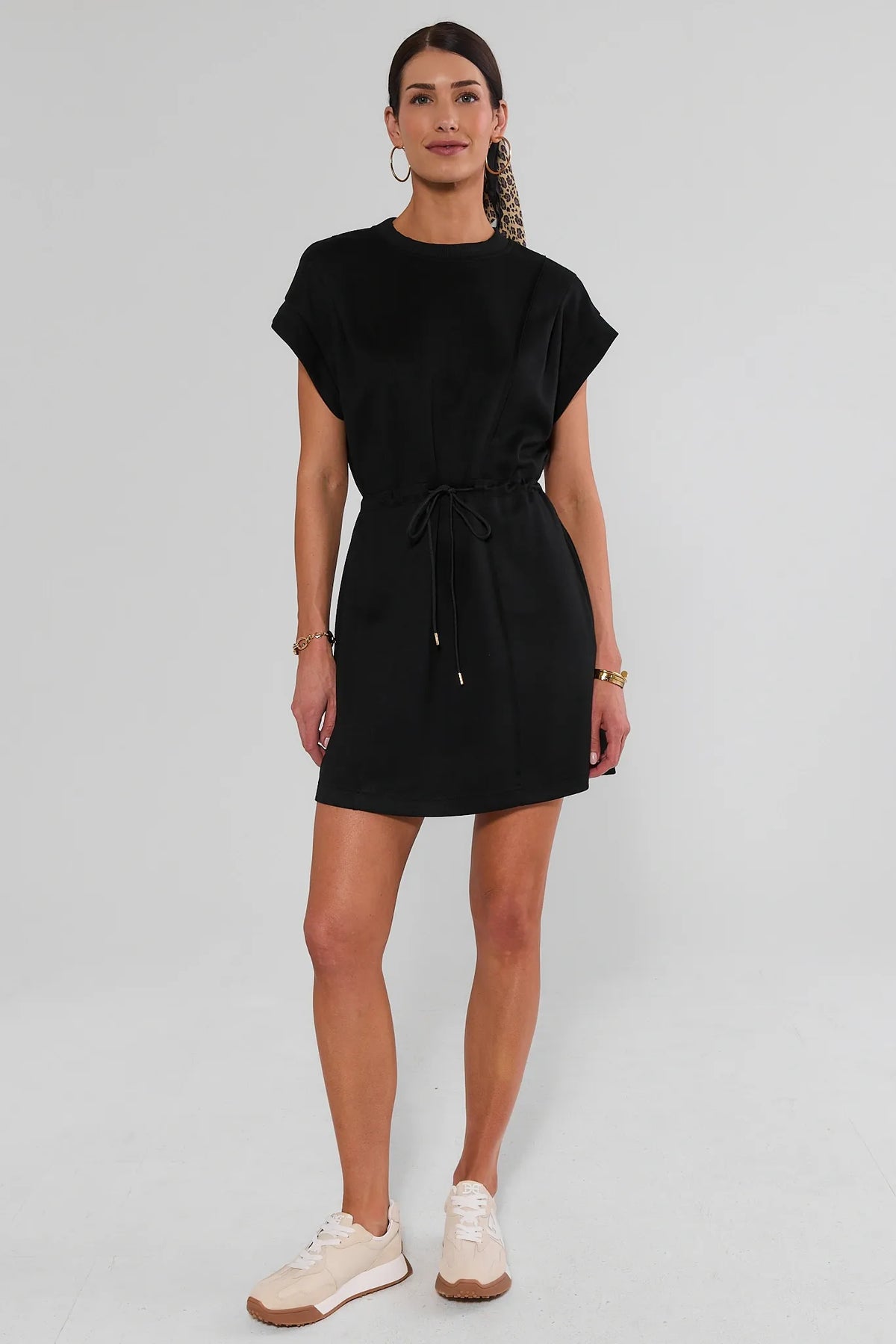 Black Drawstring Short Dress Styled with Sneakers - Full Length Front | Avara