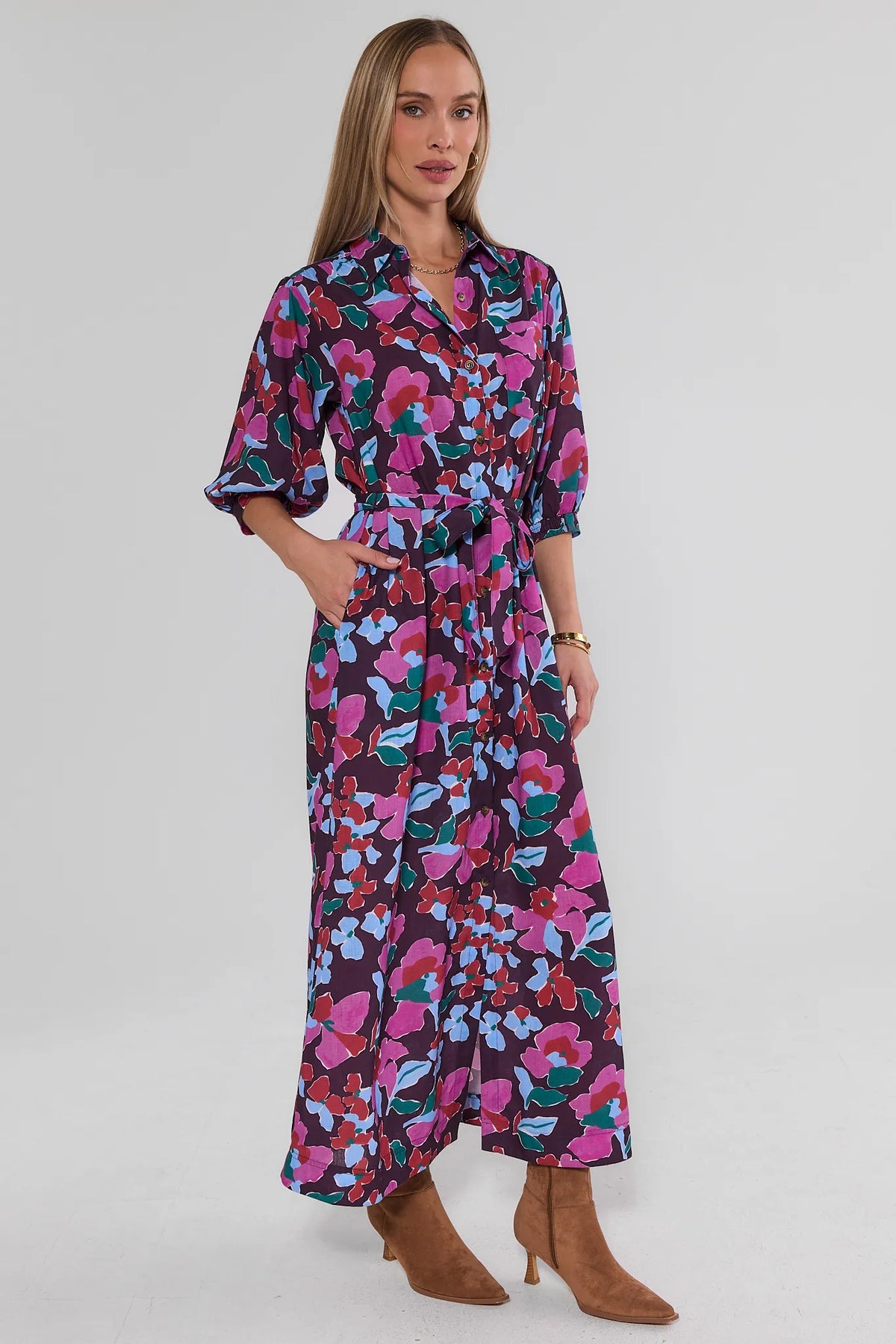 Serena Multi Floral Print Maxi Dress - Three-Quarter Side View, Hand in Pocket, Fluid Silhouette | Avara