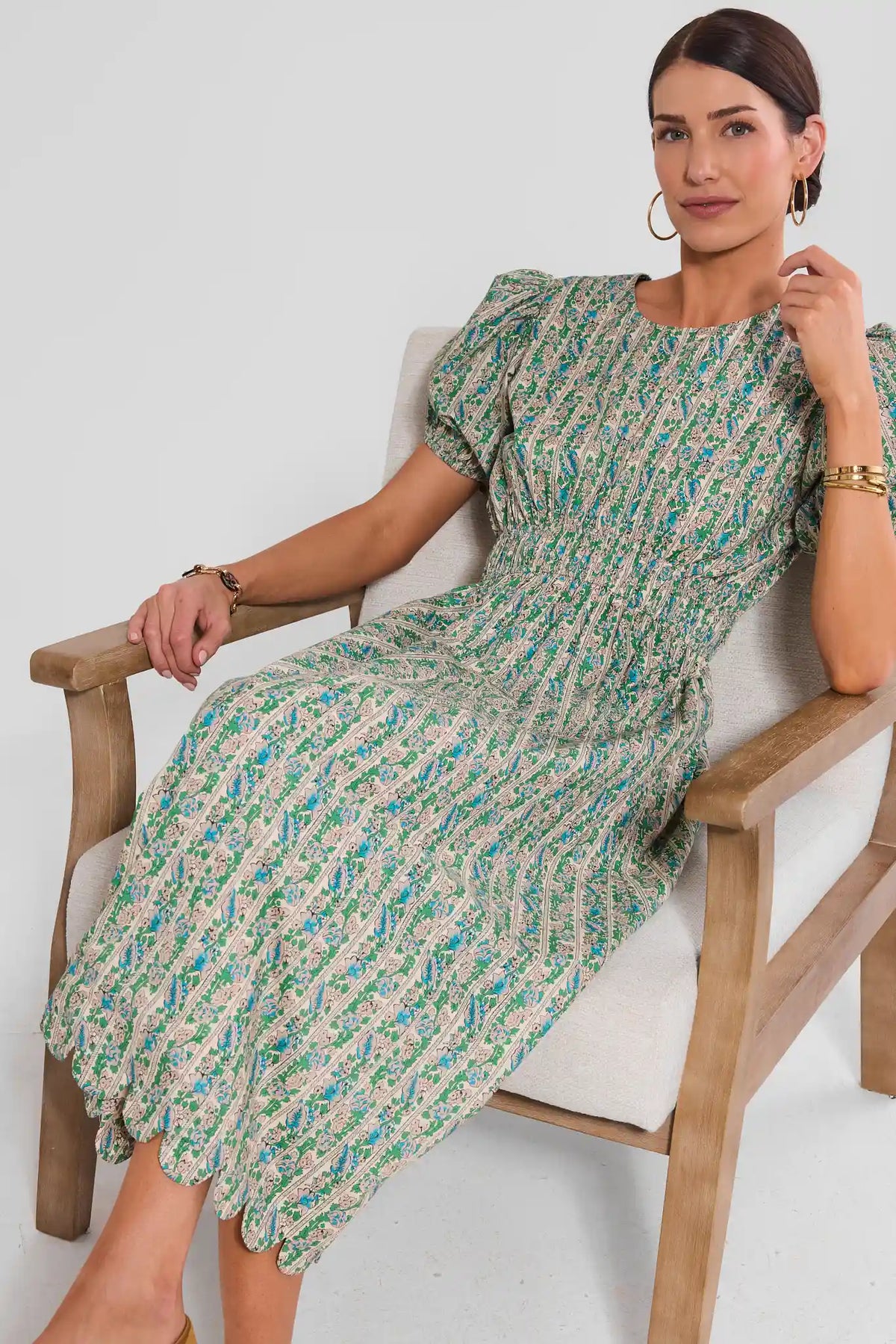Green Floral Modest Midi Dress - Seated Lifestyle Shot, Scalloped Hem On Model | Avara