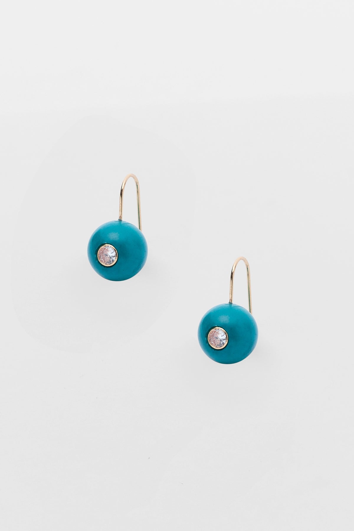 Teal Acrylic Circle Drop Earrings with Rhinestone Center & Gold Hook - Flat Lay | Avara