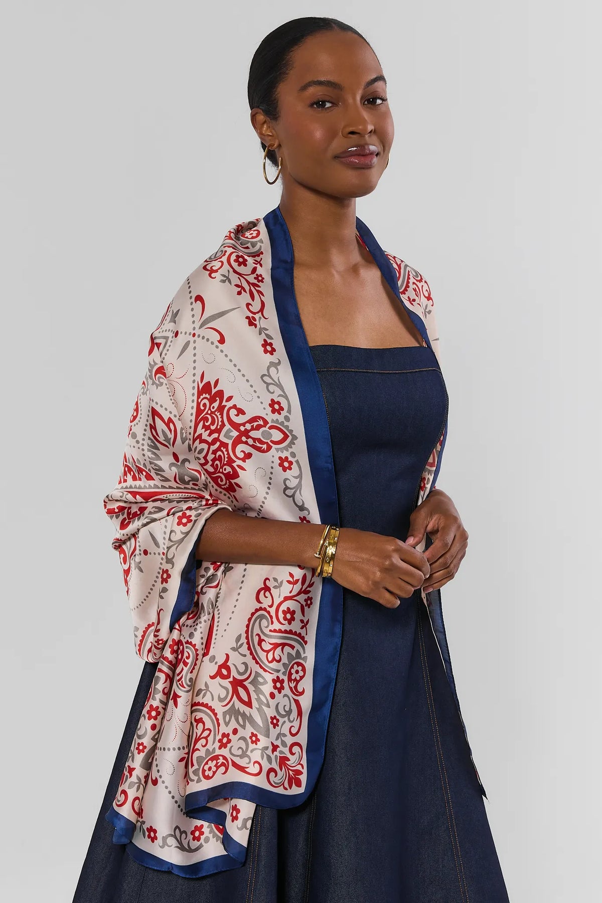 Ivory Printed Wrap Styled as Shoulder Shawl Over Navy Dress - Front View On Model | Avara