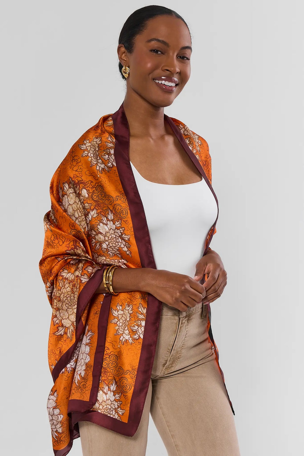 Orange Floral Printed Wrap Styled as Shawl - Front View On Model | Avara