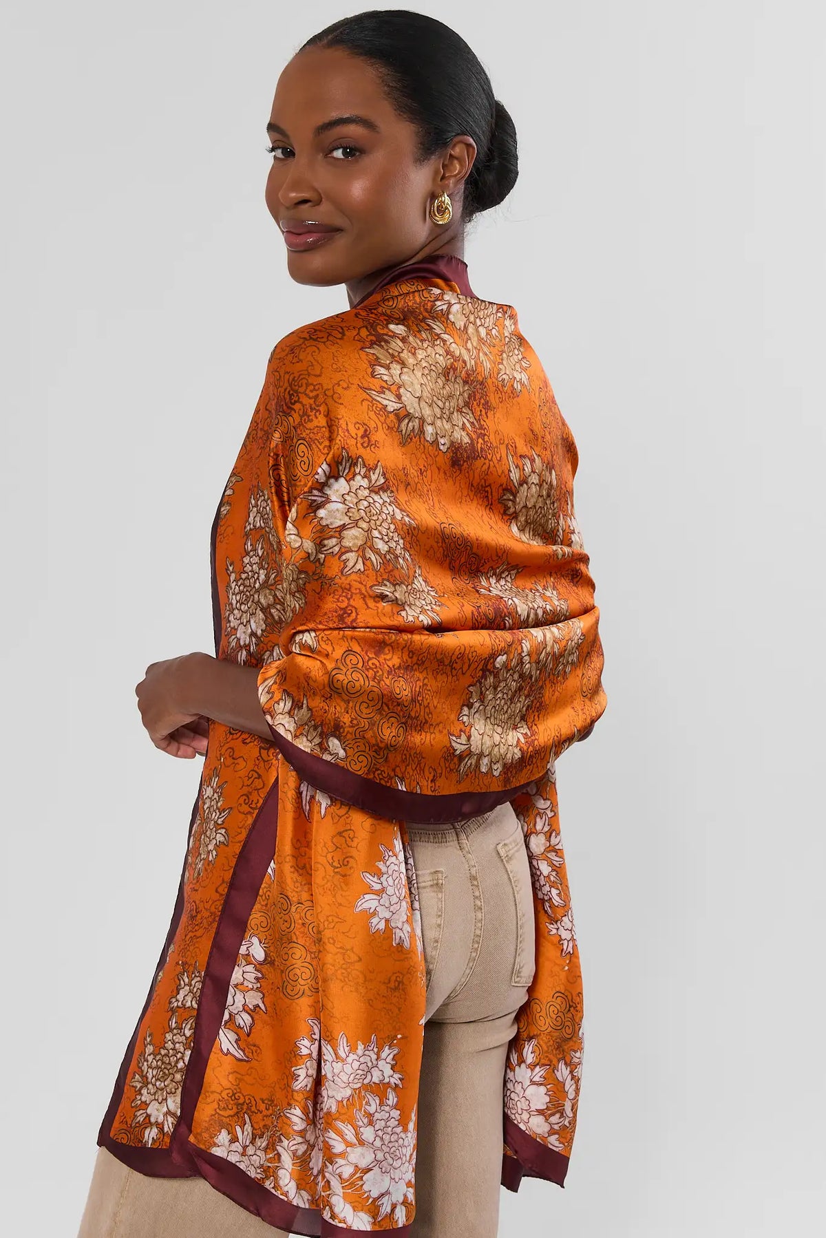 Orange Floral Printed Wrap Draped Over Shoulders - Back View On Model | Avara