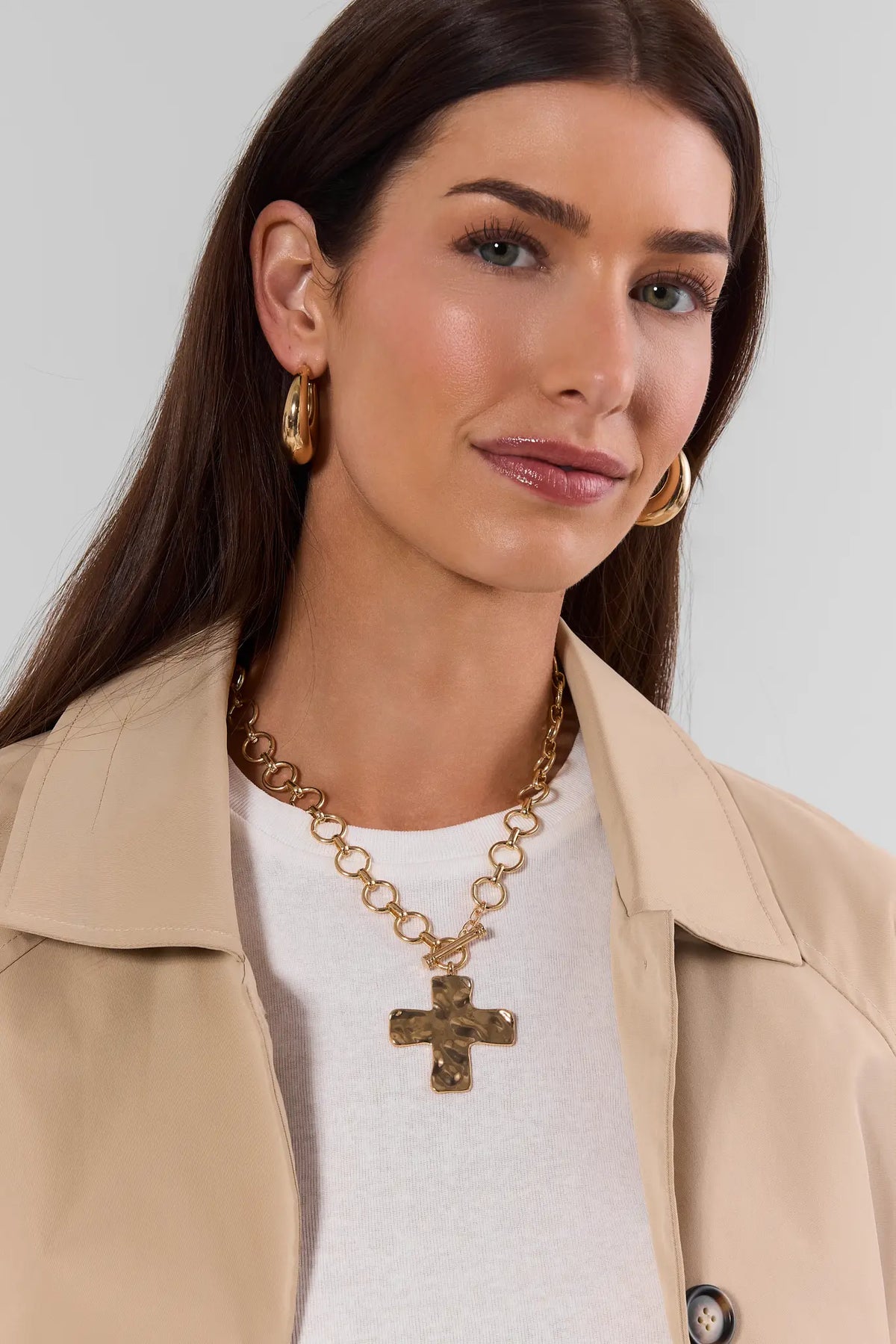 Gold Hammered Cross Necklace On Model - Styled Look with Trench Coat | Avara