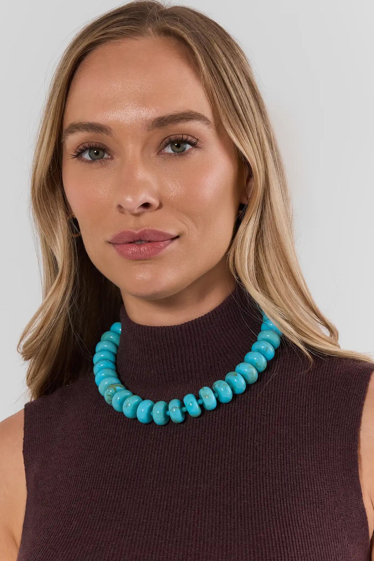 Turquoise Oversized Beaded Necklace On Model with Dark Knit Top - Front View | Avara