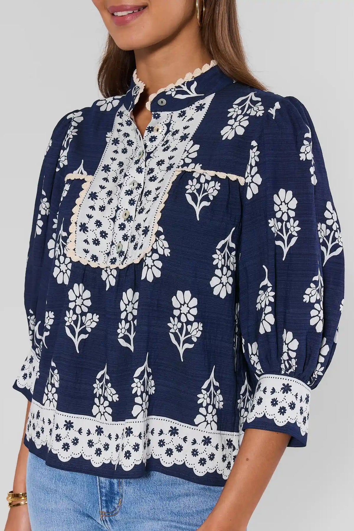 Collier Navy Floral Top by THML - 3/4 Sleeve & Eyelet Hem Close-Up | Avara