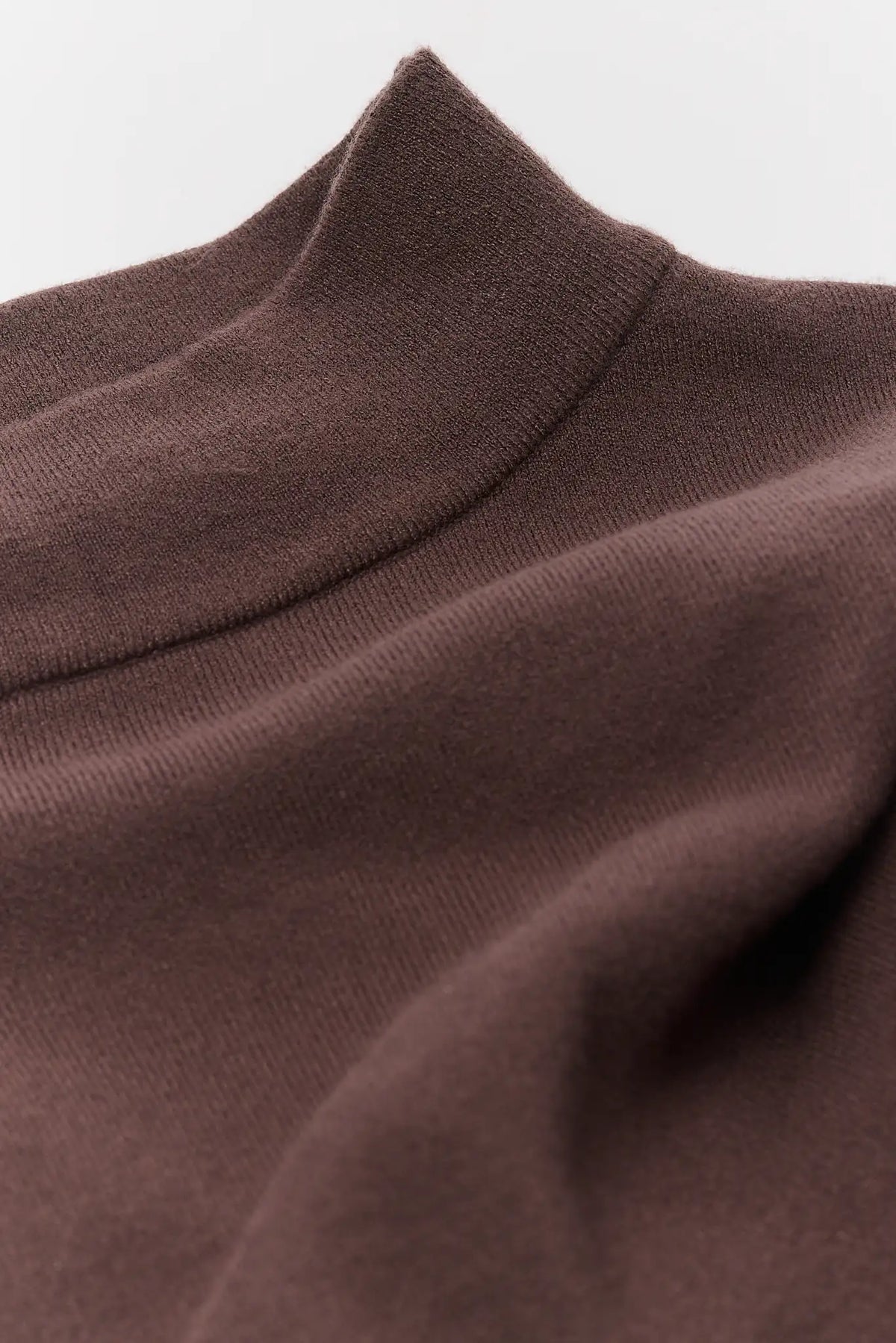 Brown Mock Neck Knit Sweater Mock Neckline Close-Up Detail On Model - Fabric & Fit | Avara
