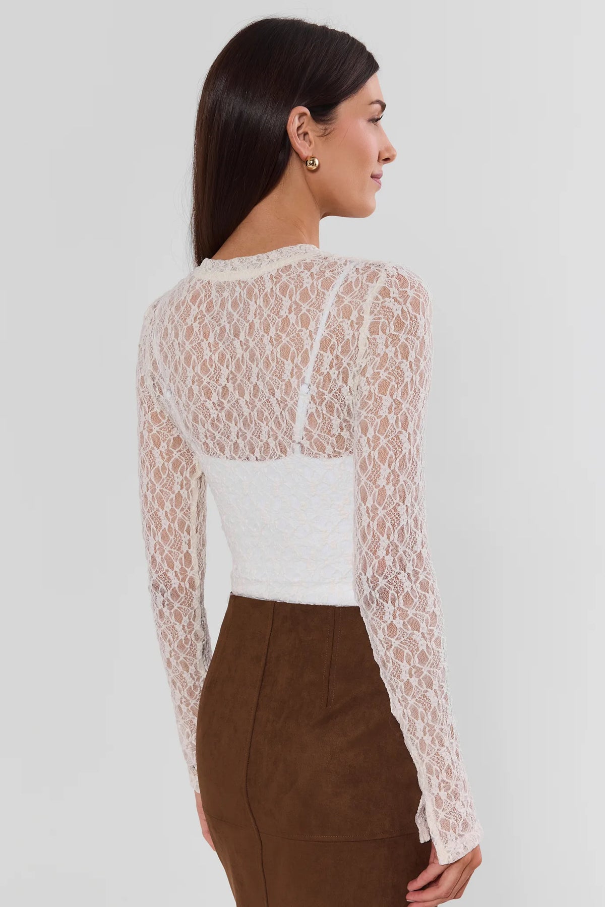 Cream Lace Long Sleeve Top - Back View, Split Cuff Detail, Styled with Brown Suede Skirt | Avara