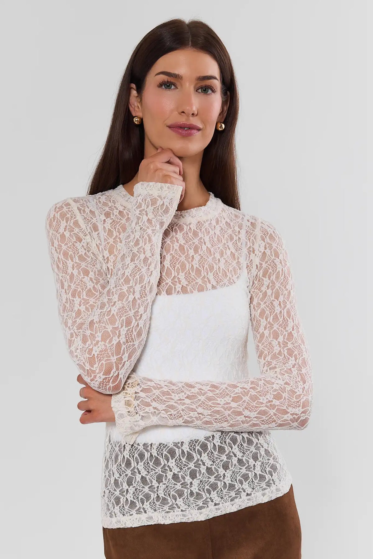 Cream Lace Top - Three-Quarter View, Hand Raised Pose Showing Long Sleeve | Avara