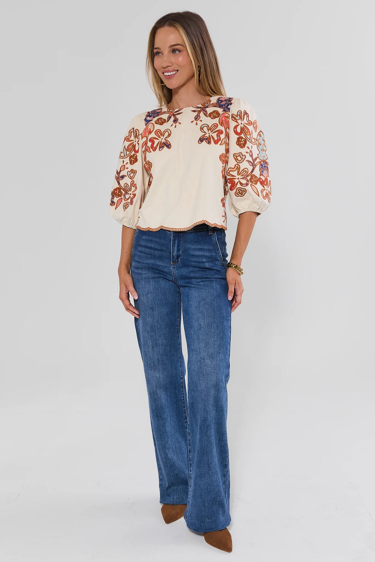 Ivory Faux Suede Embroidered Top Styled with Wide-Leg Jeans - Full Length On Model | Avara