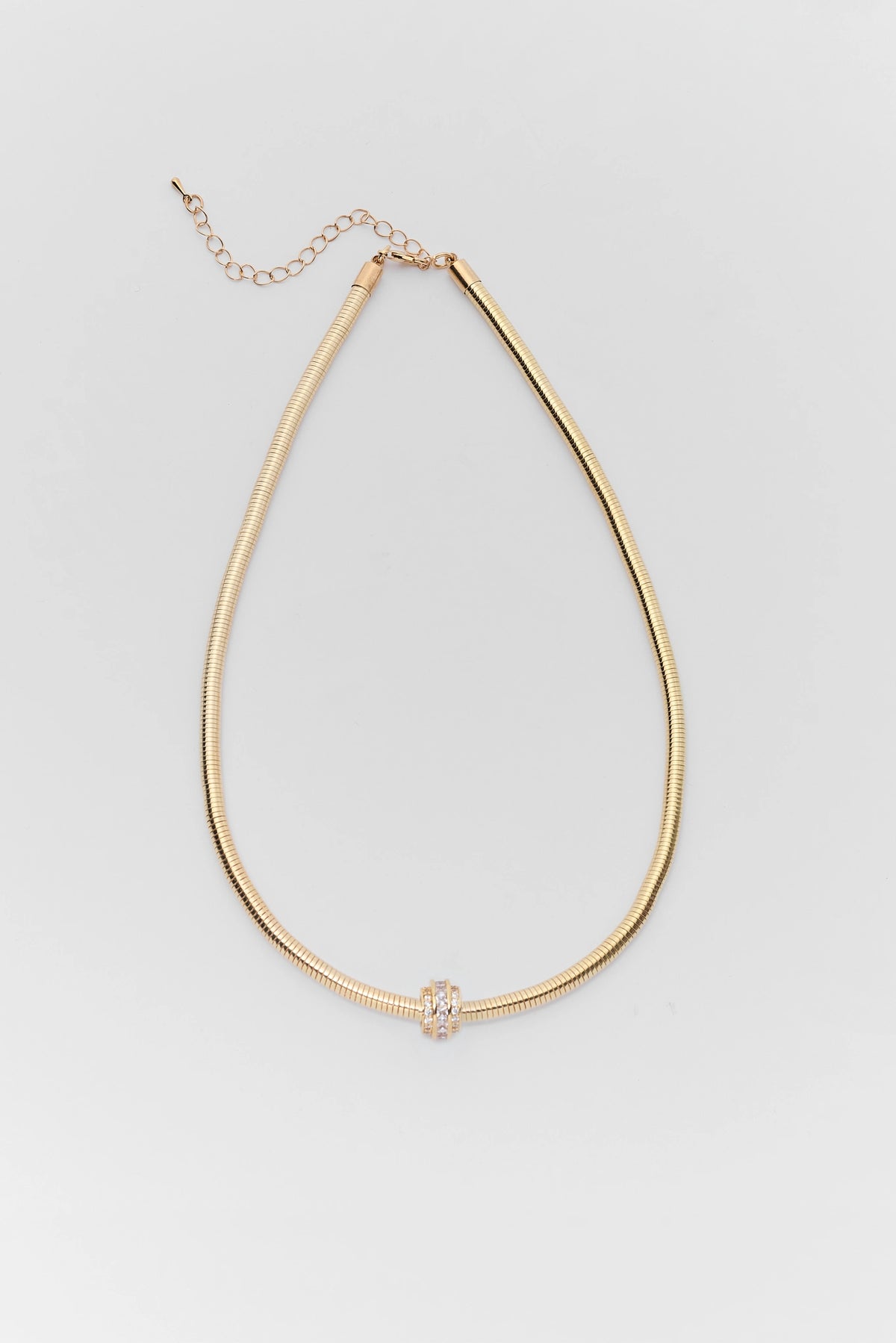 Gold Charm Snake Chain Necklace with Crystal Rondelle - Flat Lay | Avara