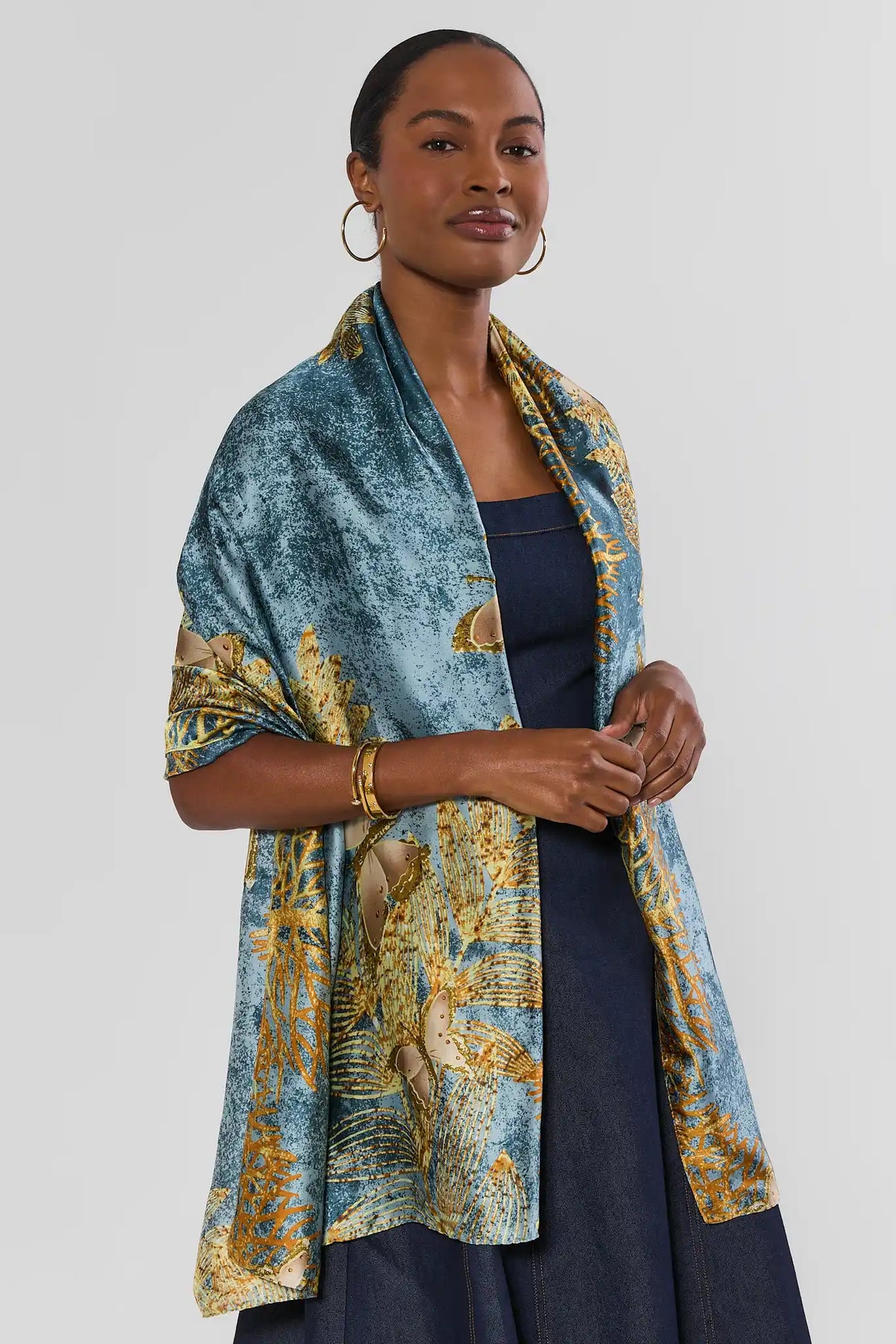 Blue Gold Printed Wrap Styled as Shawl Over Navy Dress - Front View | Avara