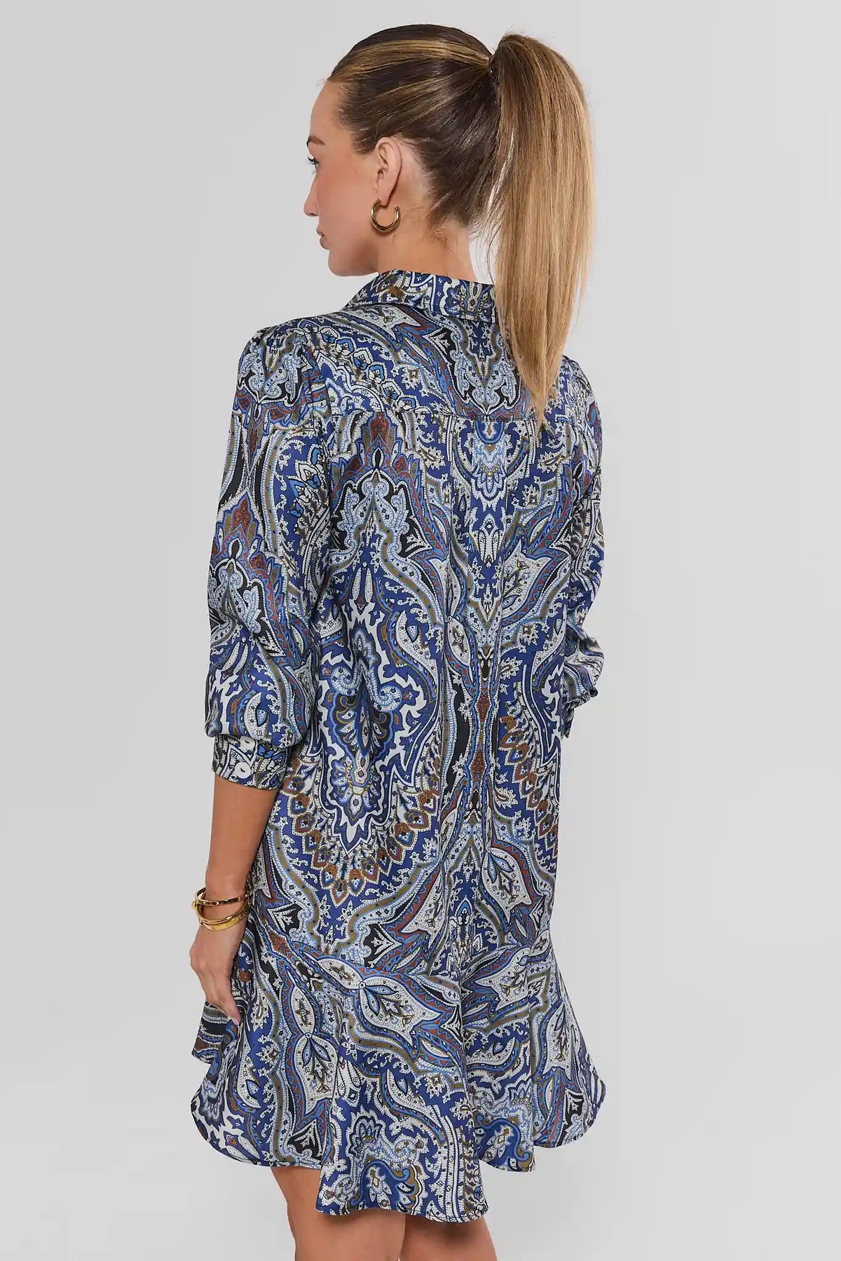 Blue Paisley Drop Waist Short Dress - Back View On Model Showing Ruffle Hem | Avara