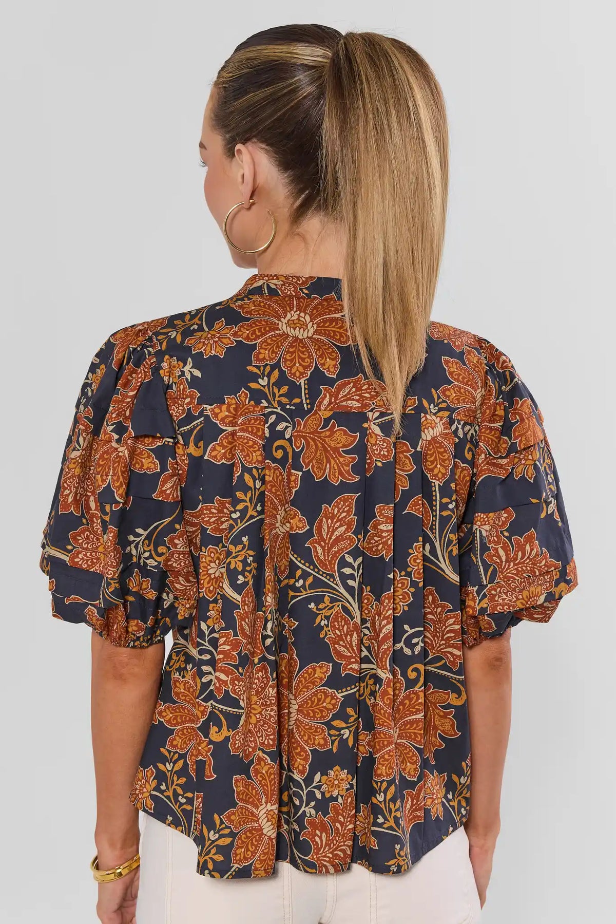 Navy Floral Printed Puff Sleeve Button-Up Top - Back View Showing Pleated Hem | Avara