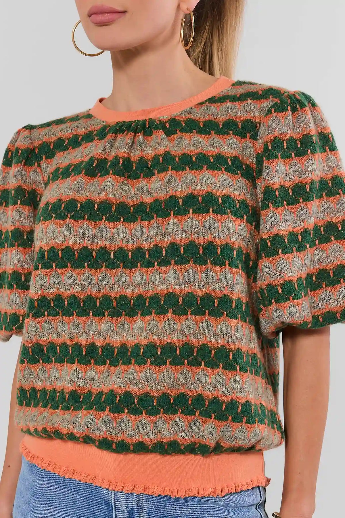 Orange Printed Knit Top - Close-Up Detail, Textured Knit Fabric & Ruffle Hem | Avara