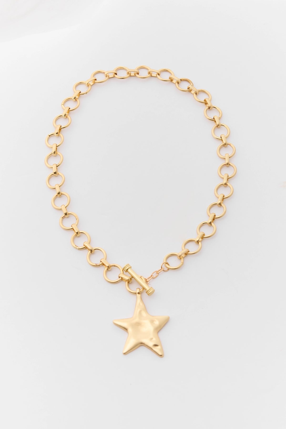 Gold Chunky Hammered Star Necklace - Flat Lay, Toggle Clasp Chain | Avara