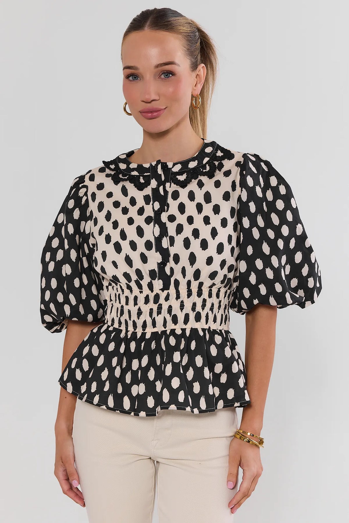 Black & Cream Contrast Polka Dot Peplum Top - Front View On Model | Avara