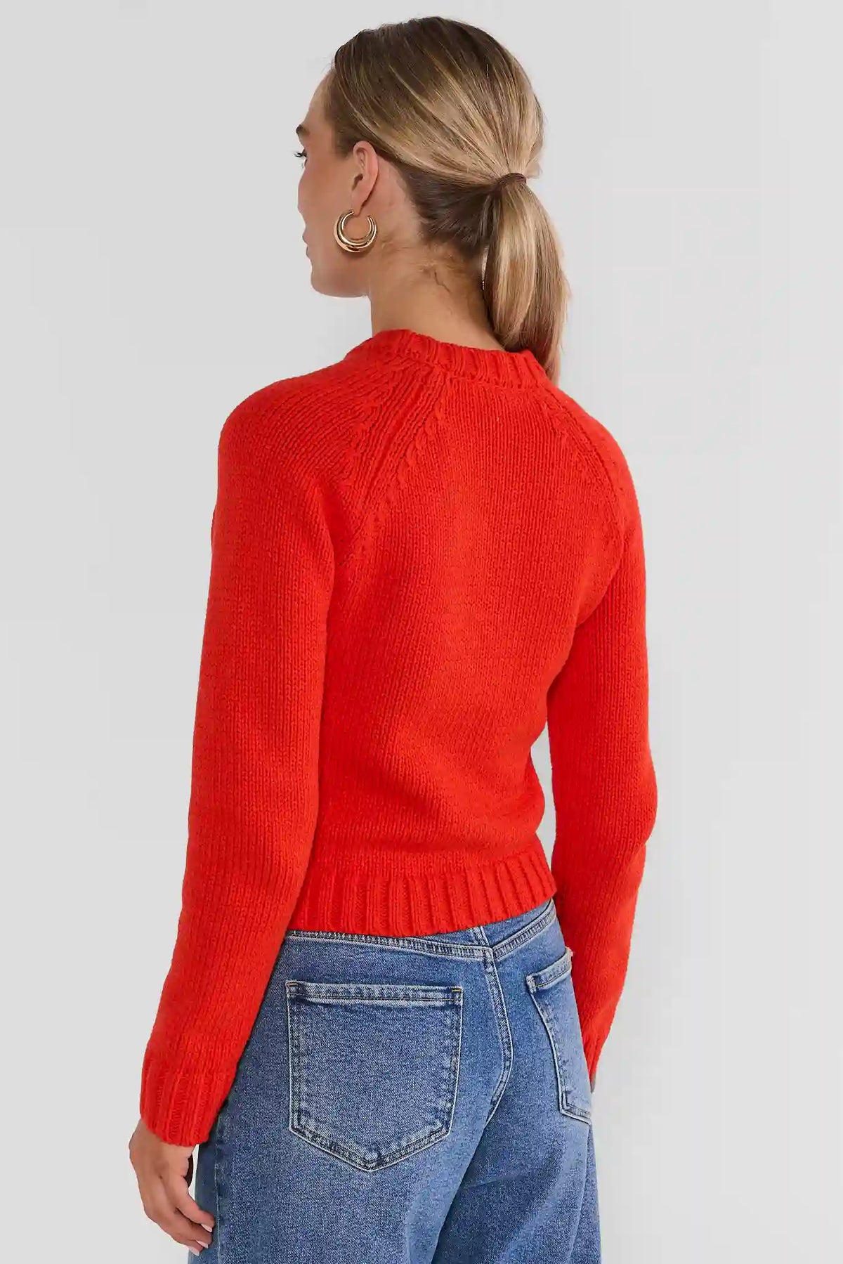 Red Cable Knit Cardigan Sweater - Back View On Model Styled with Denim | Avara