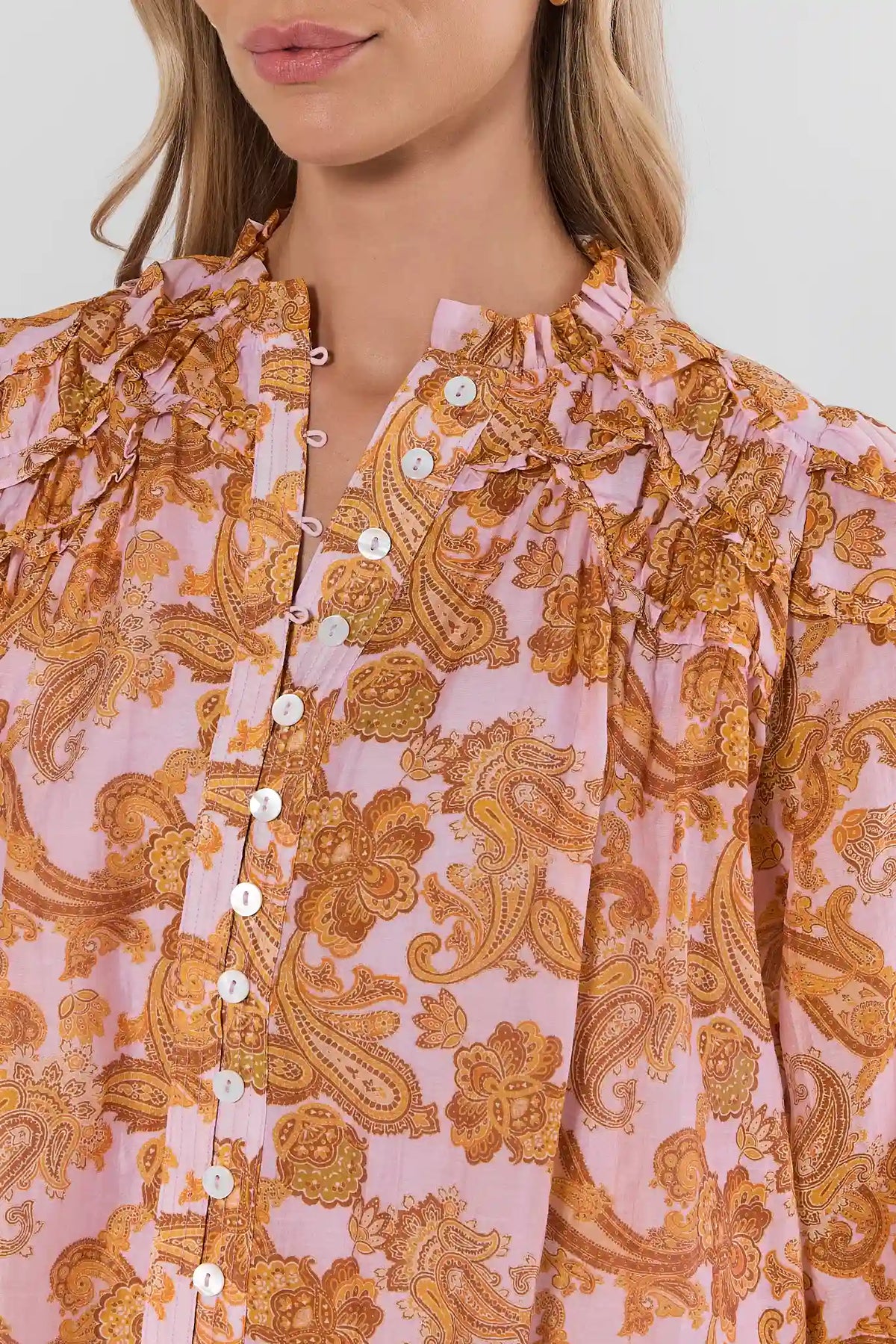 Orange Paisley Print Long Sleeve Top - Ruffle Neckline Close-Up Detail | Avara