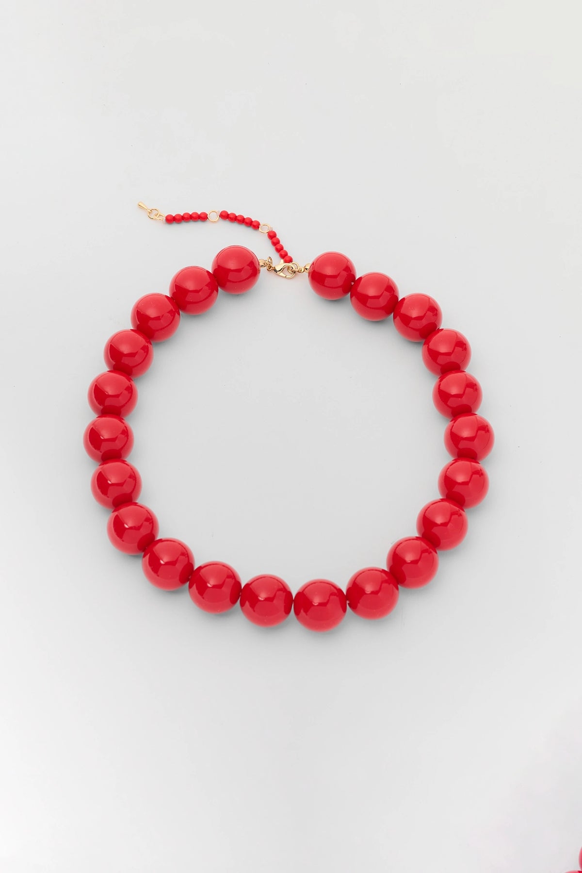 Red Chunky Beaded Statement Necklace with Gold Clasp - Flat Lay | Avara