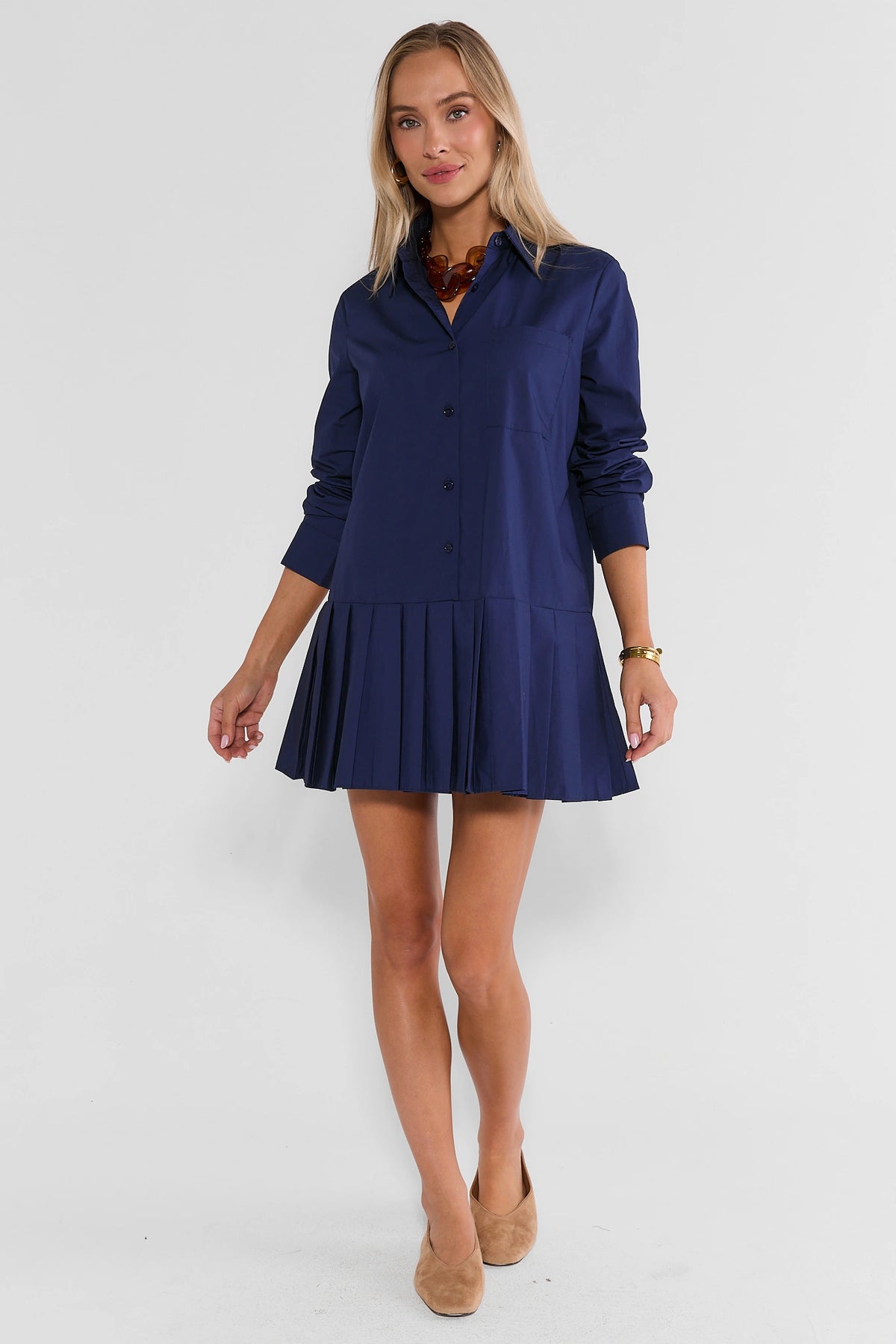 Navy Pleated Skirt Short Dress Full Length On Model with Tan Kitten Heels - Front | Avara