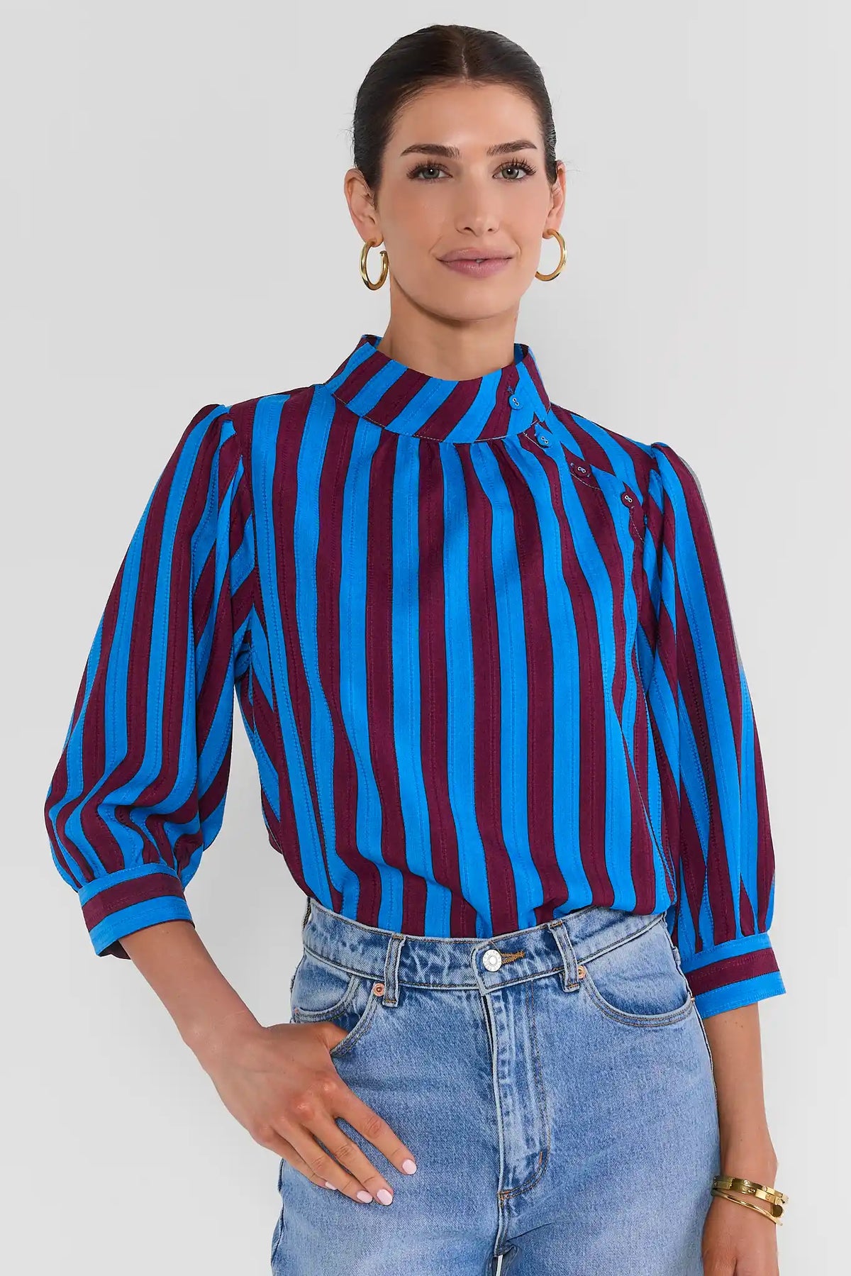 Blue Burgundy Striped Puff Sleeve Top - On Model Front View, Paired with Light Wash Jeans | Avara