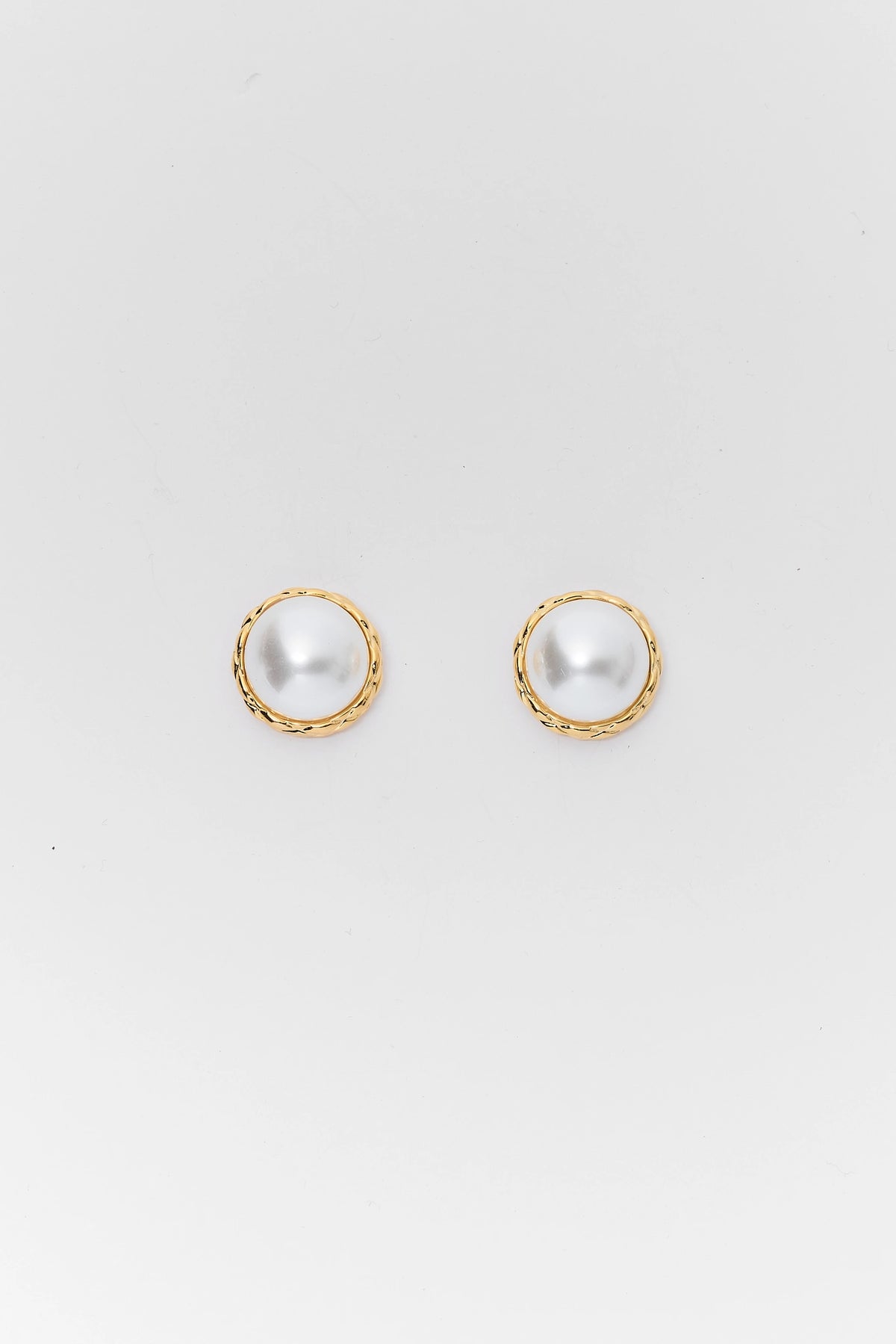 Gold Oversized Faux Pearl Stud Earrings - Flat Lay Detail | Avara
