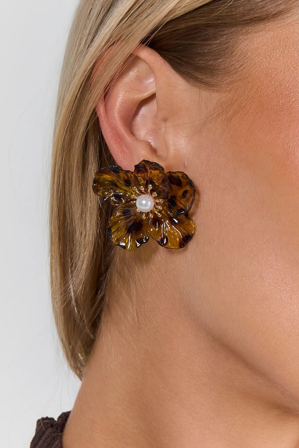 Tan Tortoise Flower Stud Earring on Model - Close-Up Ear Detail | Avara
