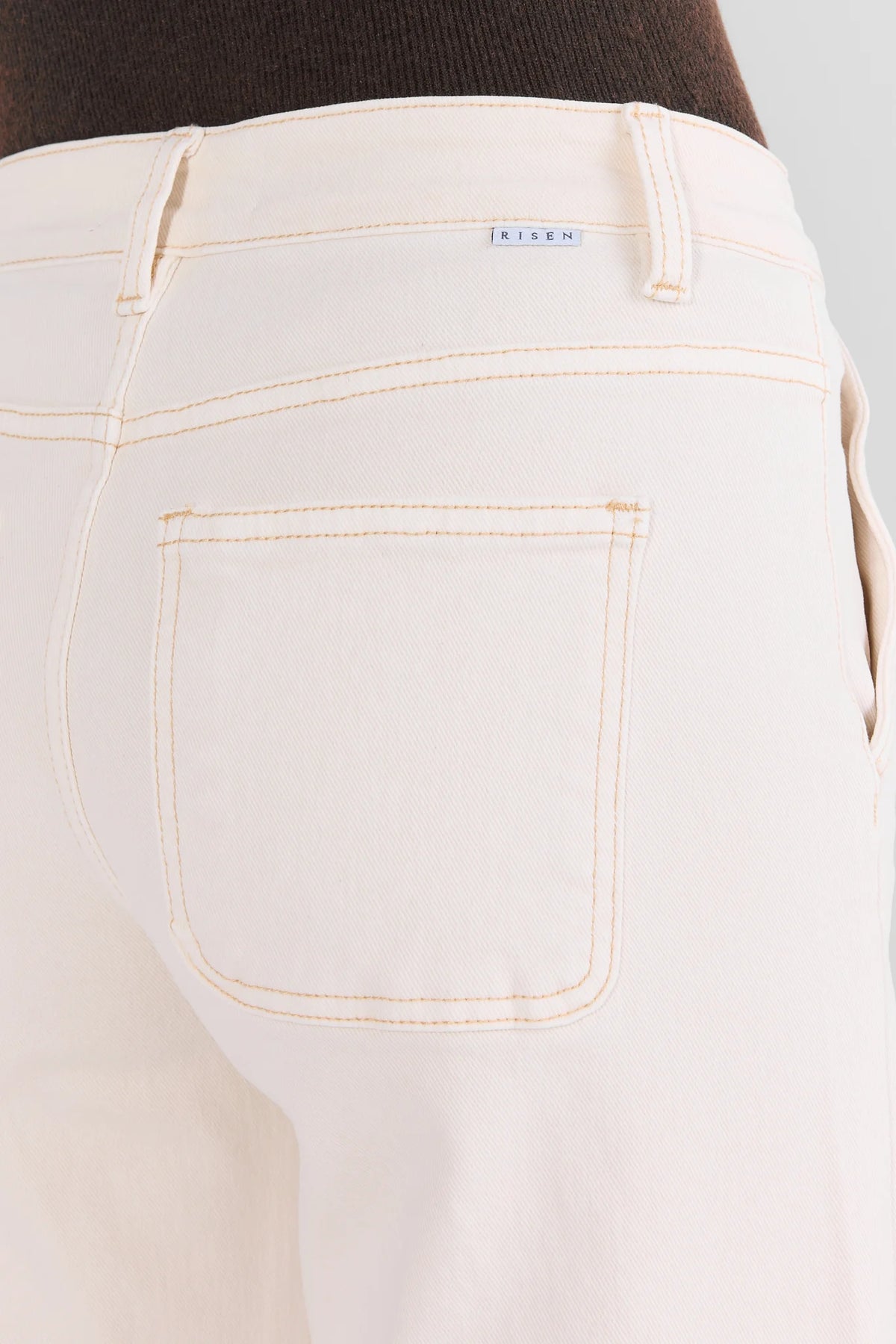 Ecru Denim Jeans - Back Pocket & Contrast Stitch Detail Close-Up | Avara