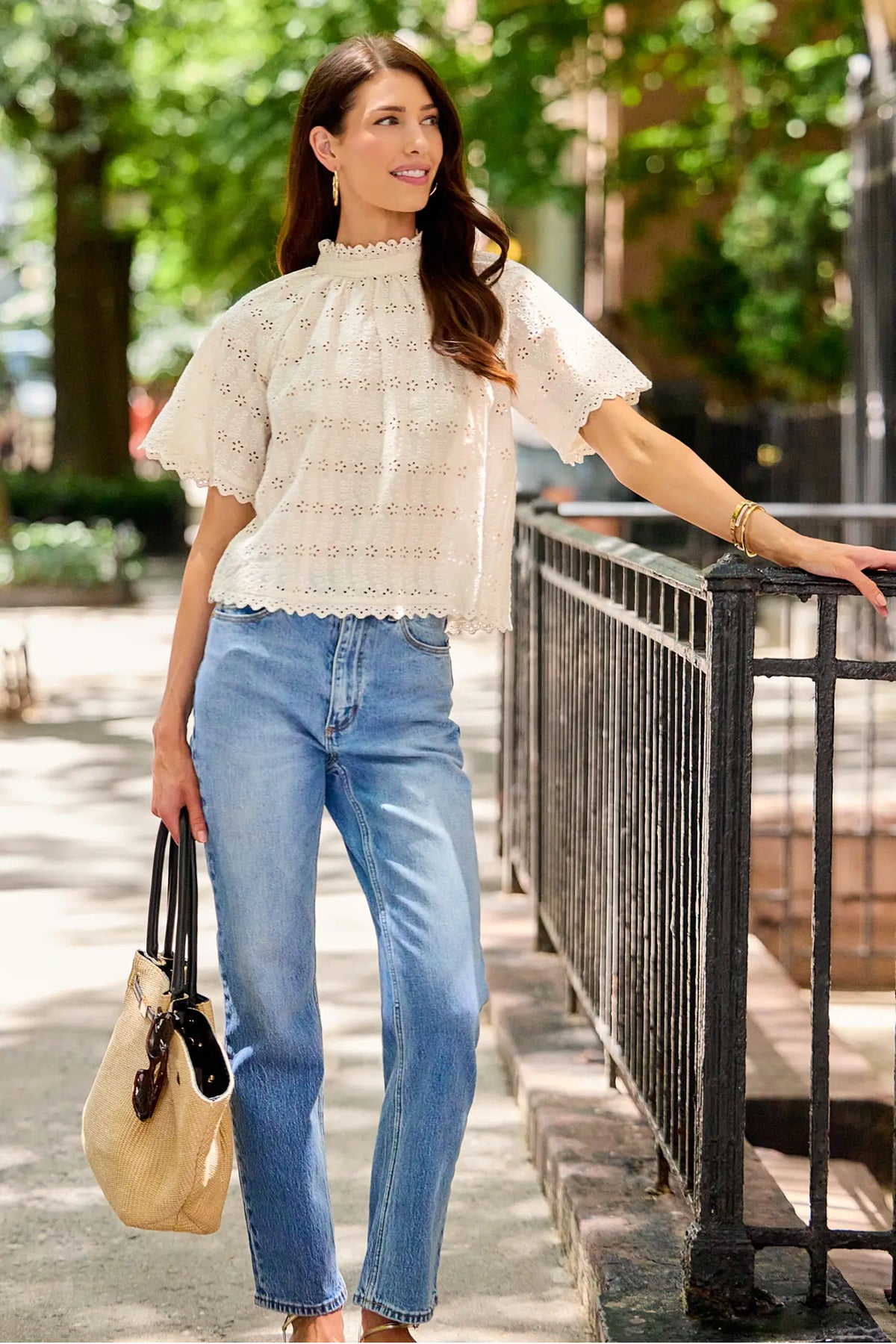 White Floral Eyelet Top styled with jeans and straw bag, full-length outdoor look perfect for brunch | Avara