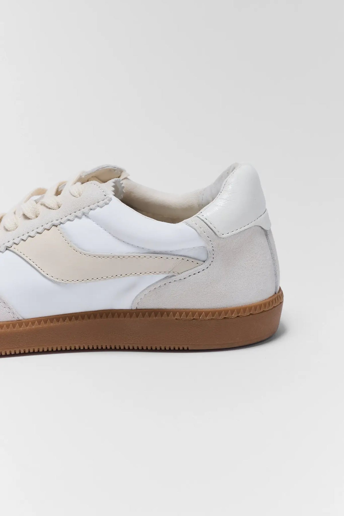 Dolce Vita Notice Sneaker heel and suede panel close-up with gum sole detail | Avara