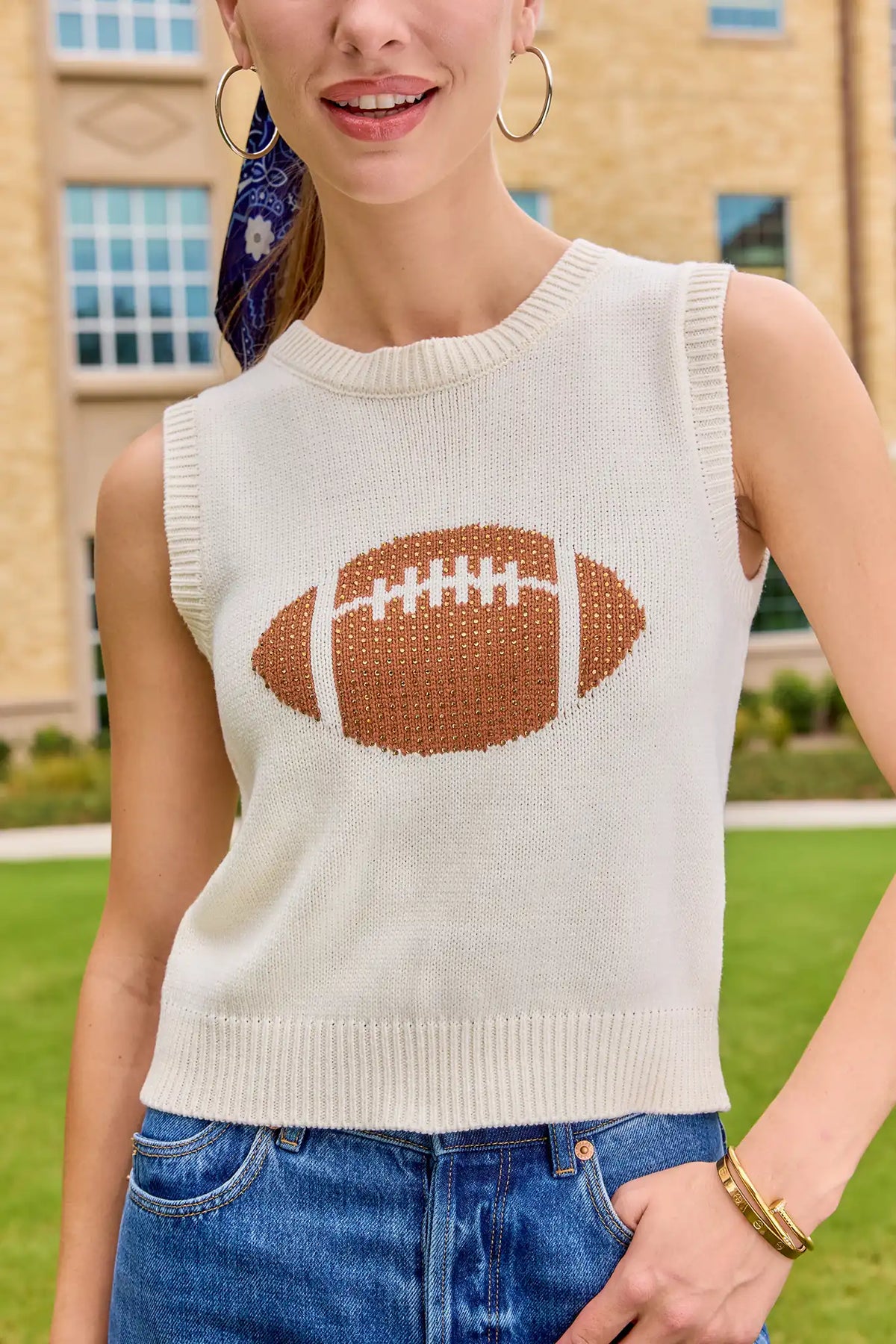 AJ White Football Sleeveless Knit Top cropped close-up, rhinestone football graphic on cream knit | Avara