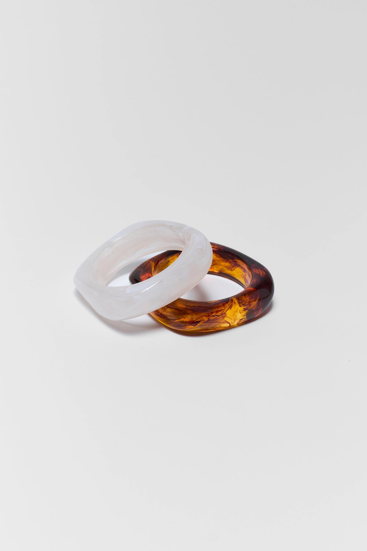 White and tortoise acrylic bangle bracelet set - Flat Lay | Avara