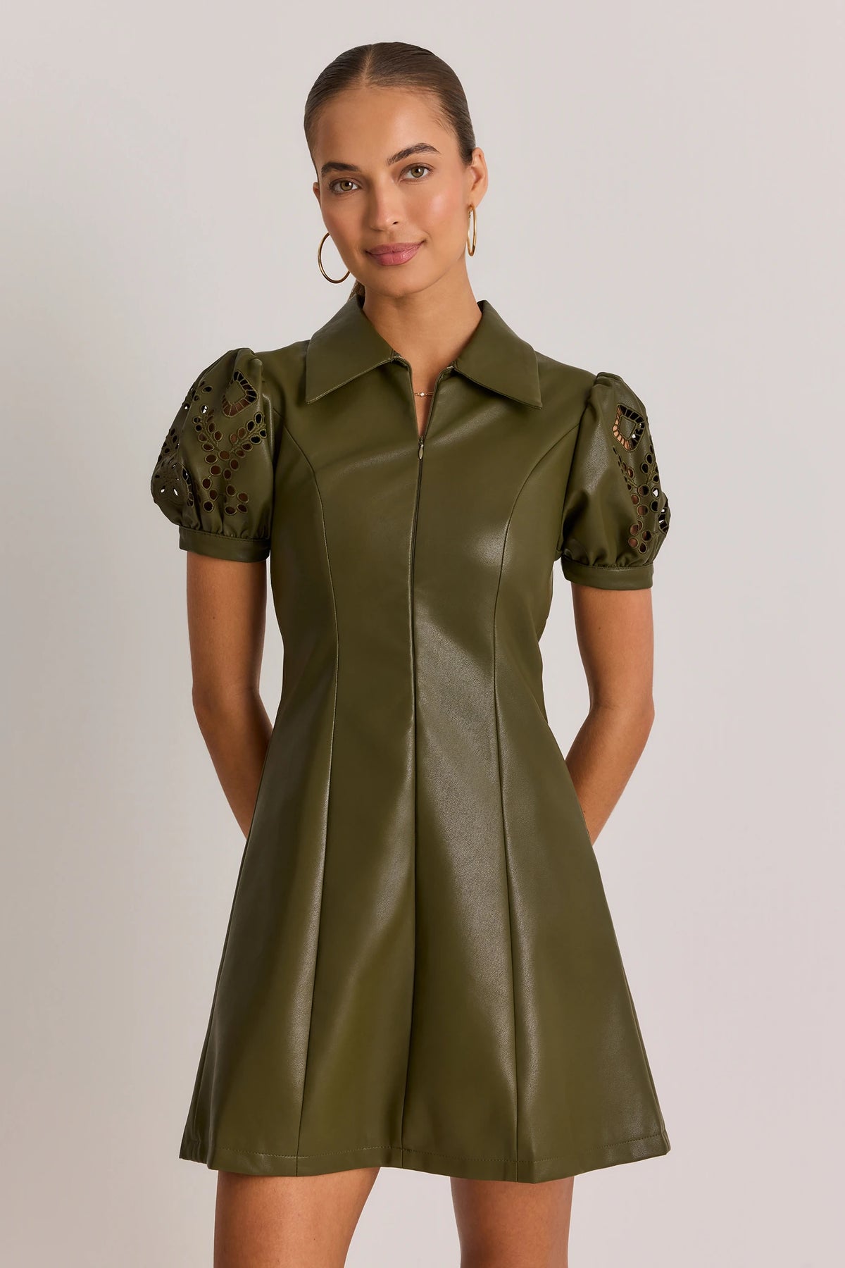 Olive Green Faux Leather Short Dress - Front View, Zip-Up Collar, Eyelet Puff Sleeves | Avara