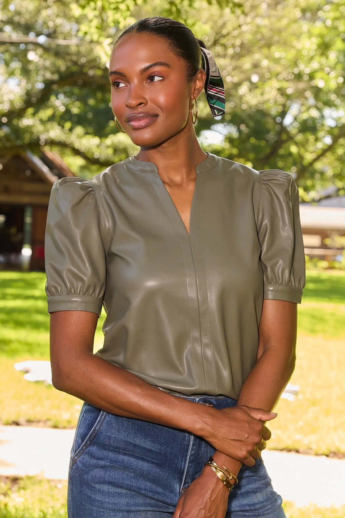 Olive Faux Leather Puff Sleeve Top - Outdoor Lifestyle Shot with Jeans & Scarf | Avara