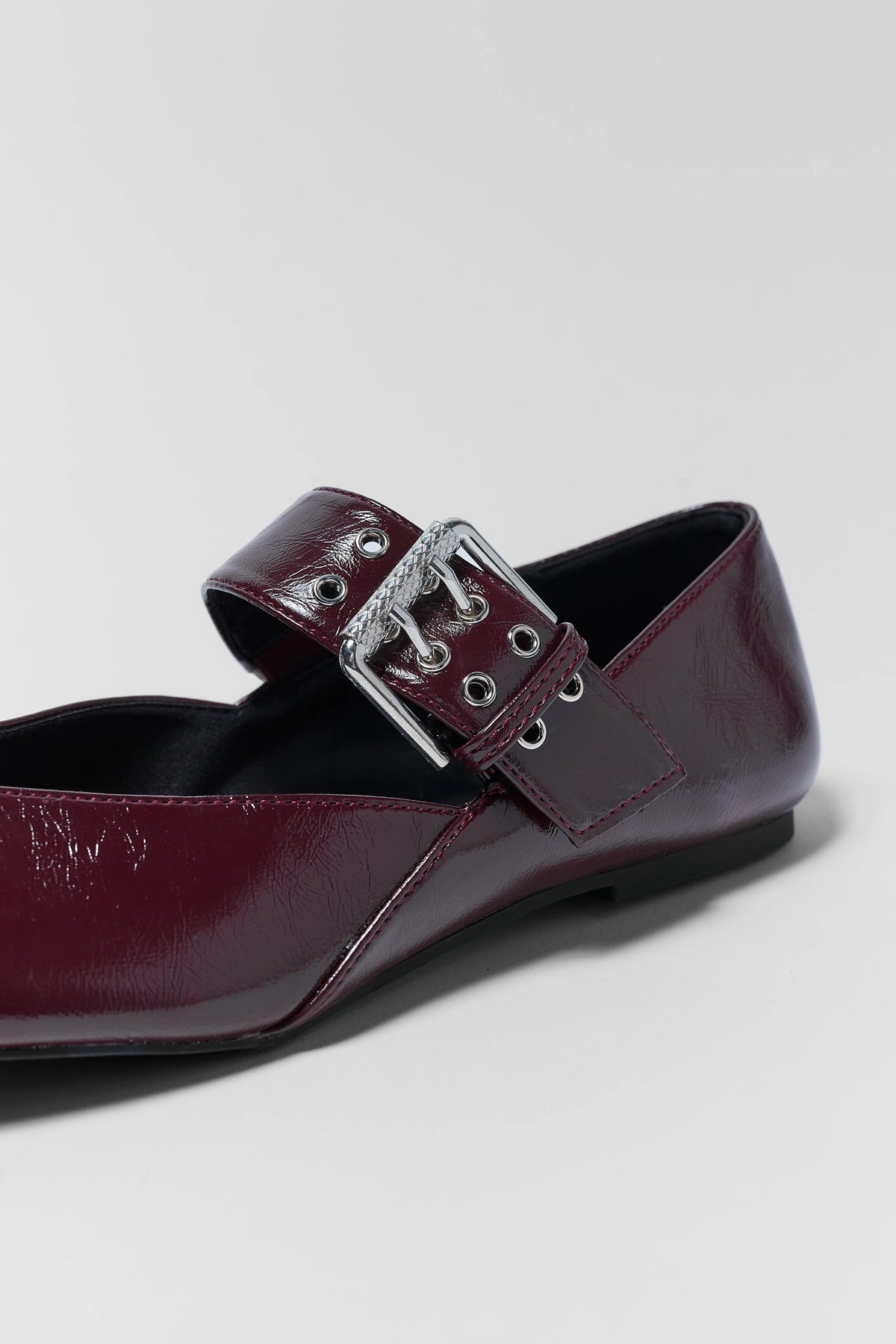 Aspen Maroon Faux Leather Flat - Silver buckle and eyelet strap close-up detail | Avara
