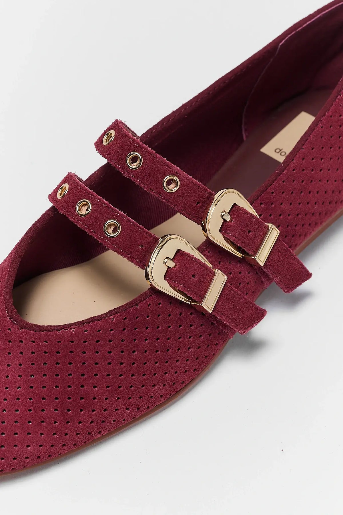 Burgundy Perforated Suede Ballet Flats - Gold Grommet Strap Close-Up Detail | Avara