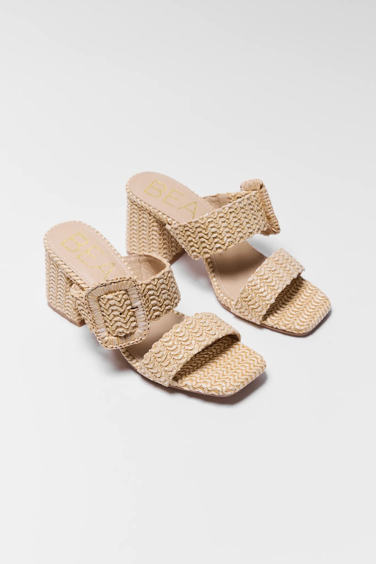 Natural raffia woven block heel sandals with oversized buckle detail - Pair View | Avara