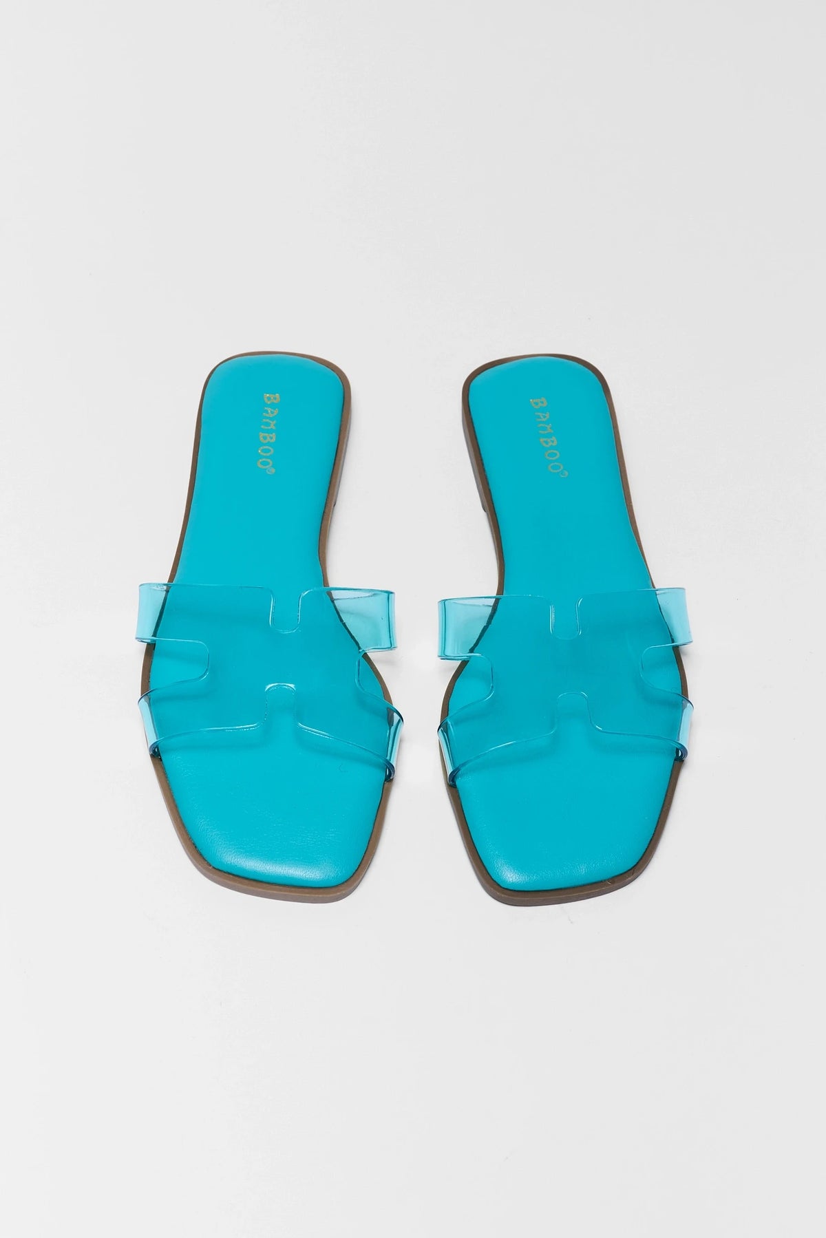 Turquoise blue jelly sandals women's pair top-down view, H-strap design and square toe | Avara