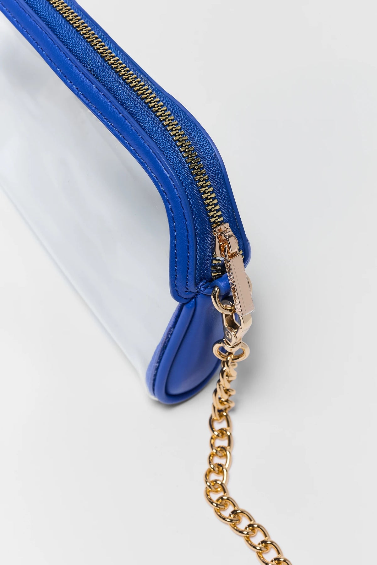 Blue Trim Clear Crossbody Bag - Gold zipper pull and chain strap hardware close-up detail | Avara