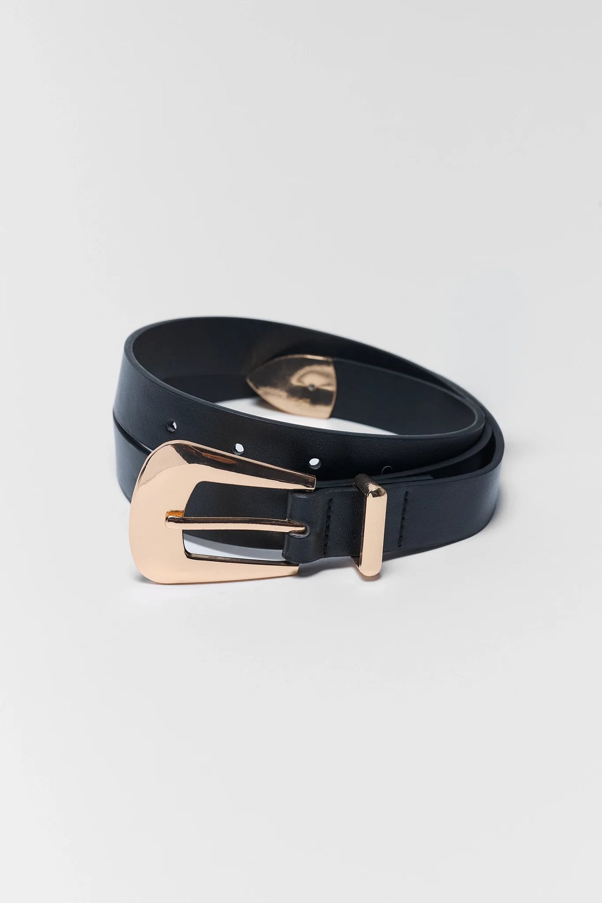Black faux leather belt with gold-tone buckle, coiled - Boston Belt Angled Detail | Avara