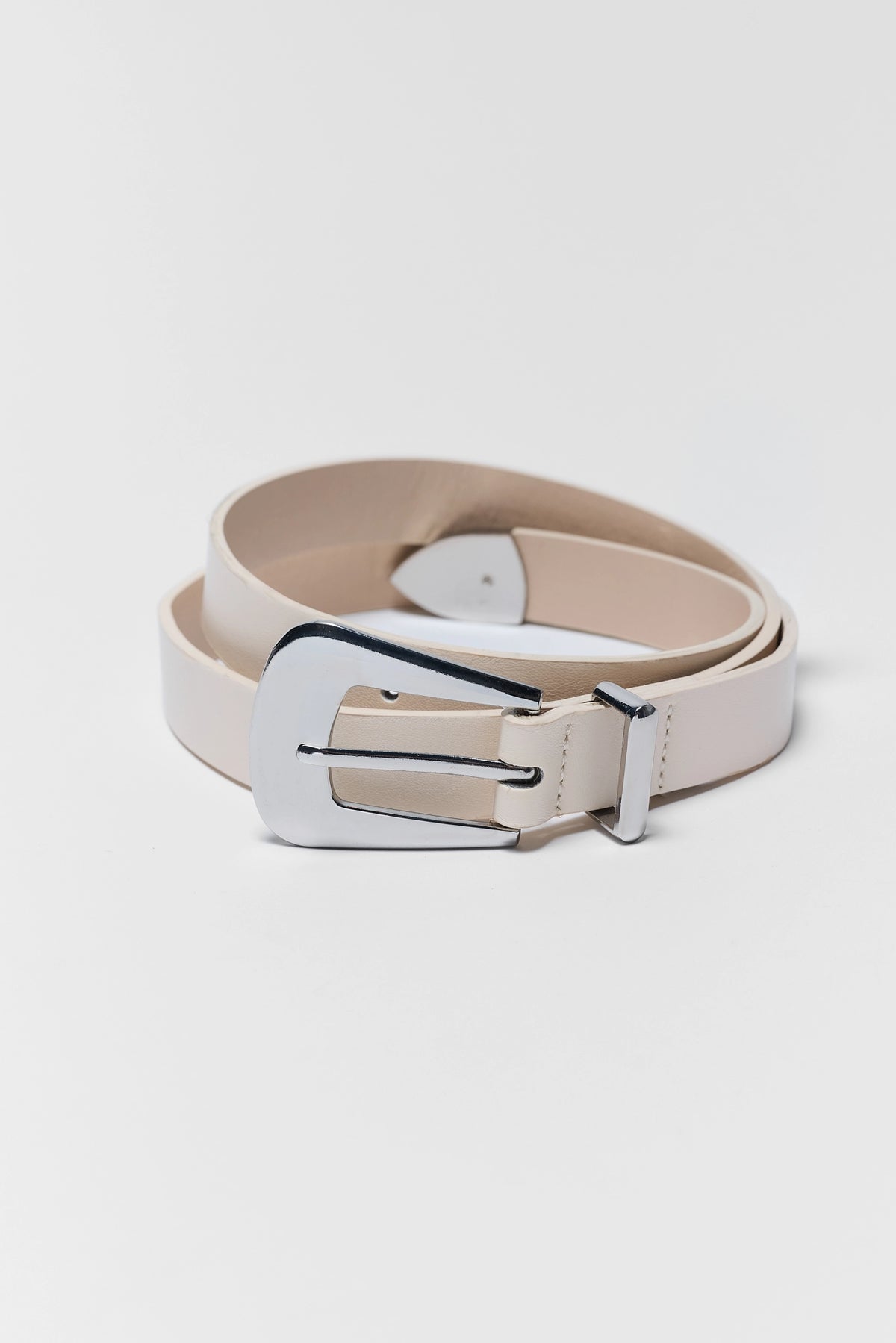 Boston Ivory Faux Leather Belt coiled, silver-tone buckle detail - Close-Up | Avara