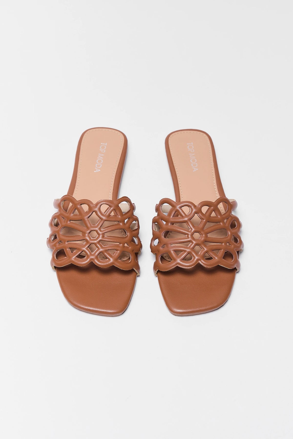 Brown floral cutout slide sandals - top-down view showing faux-leather woven strap detail | Avara