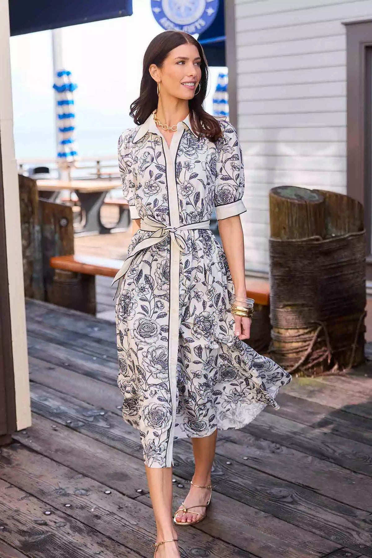Caitlyn Navy Floral Print Midi Dress styled on model at coastal pier - On Model Lifestyle Shot | Avara