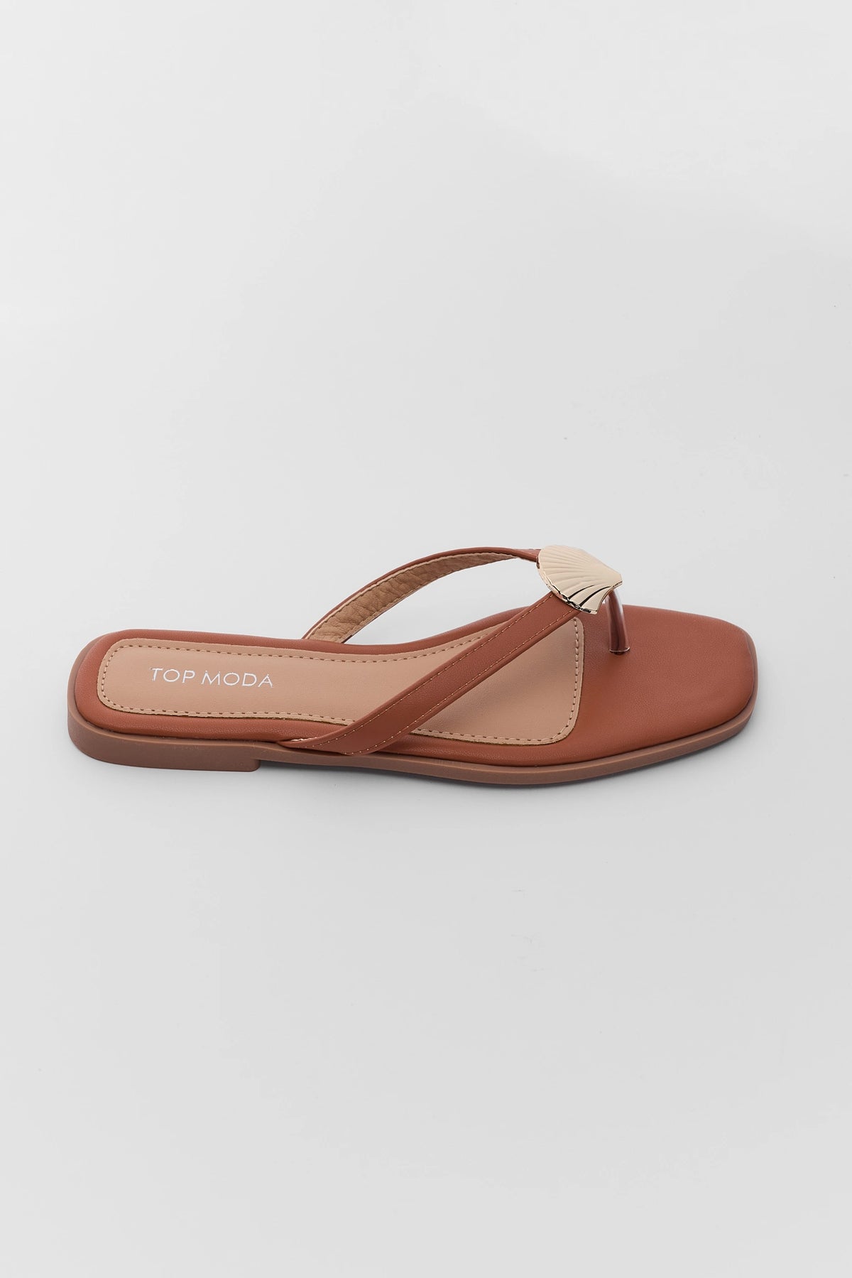 Camel flat sandal with gold shell detail and thong strap - Side Profile | Avara