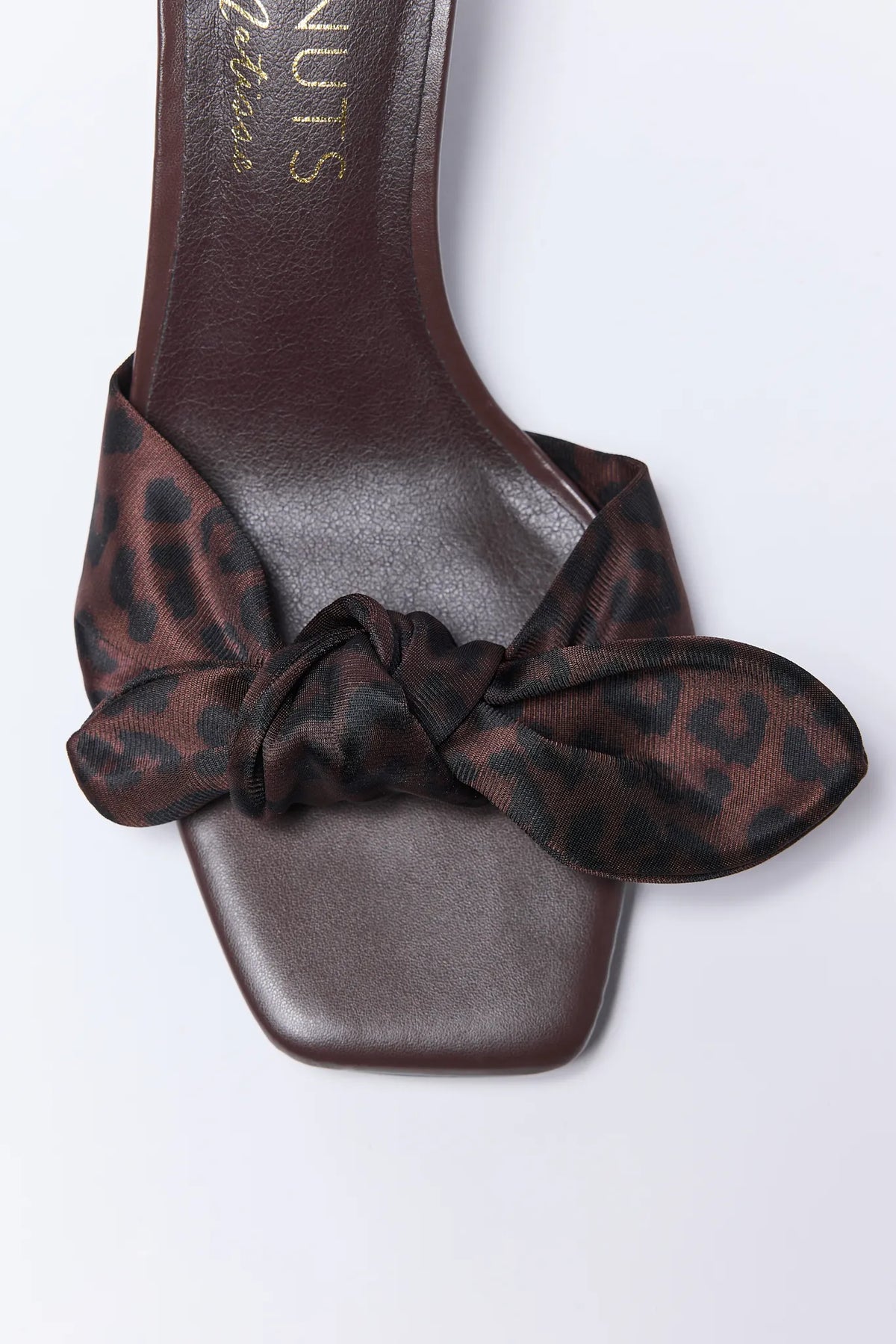 Carrie Heels by Matisse - Close-up of knotted leopard print strap detail on brown faux leather square toe footbed | Avara