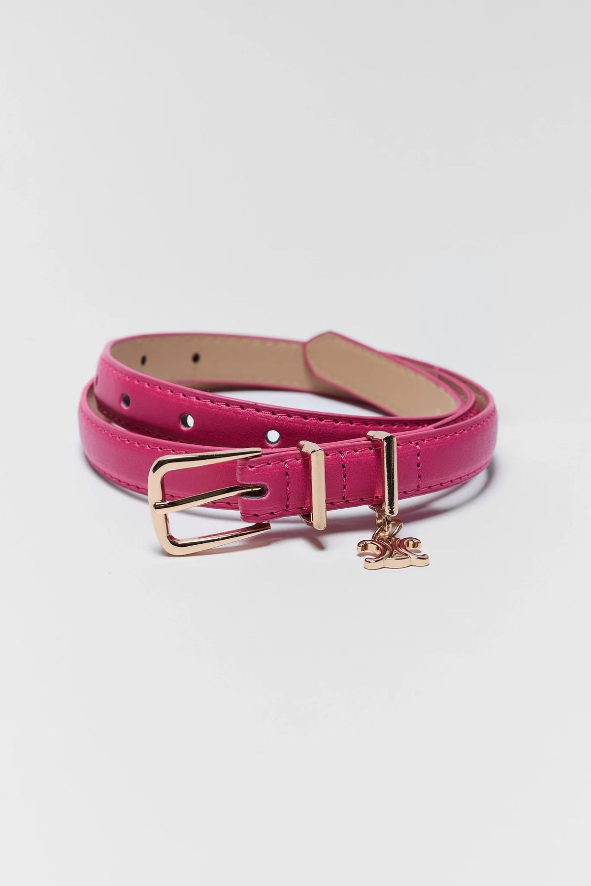 Chelsea Pink Faux Leather Belt with gold buckle and charm - Coiled Flat Lay | Avara