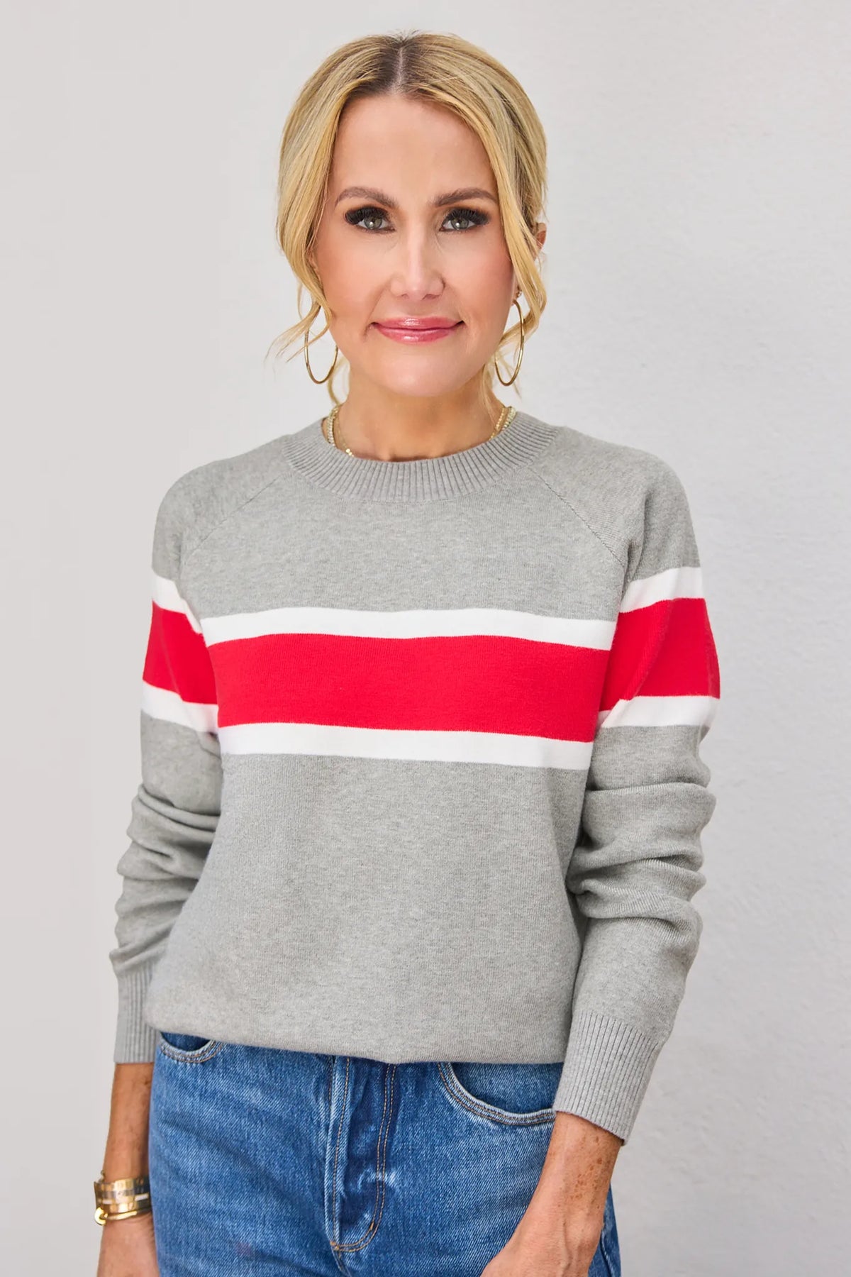 Dylan Red Stripe Sweater front view, heather gray crewneck knit with red and white horizontal stripes, styled with blue jeans | Avara
