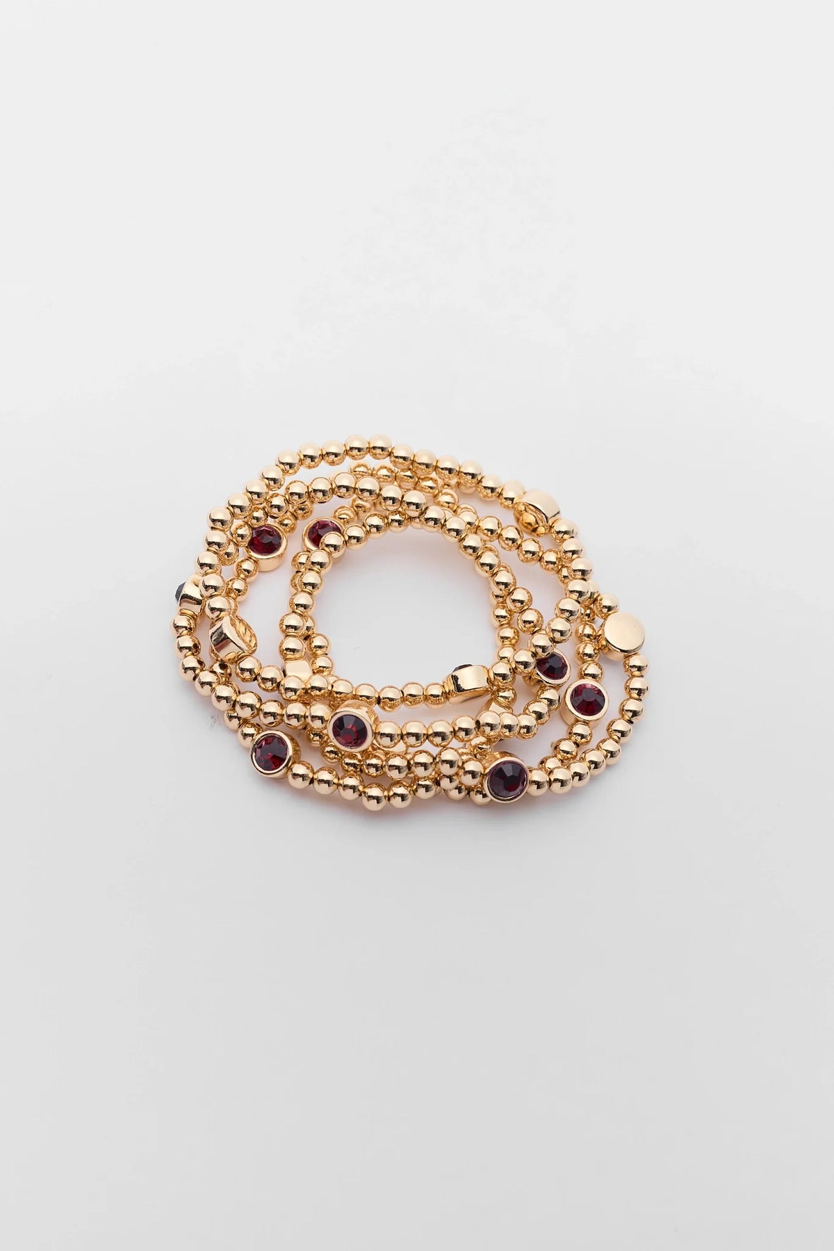 Gold Beaded Maroon Rhinestone Bracelet Set - Flat Lay Stack View | Avara