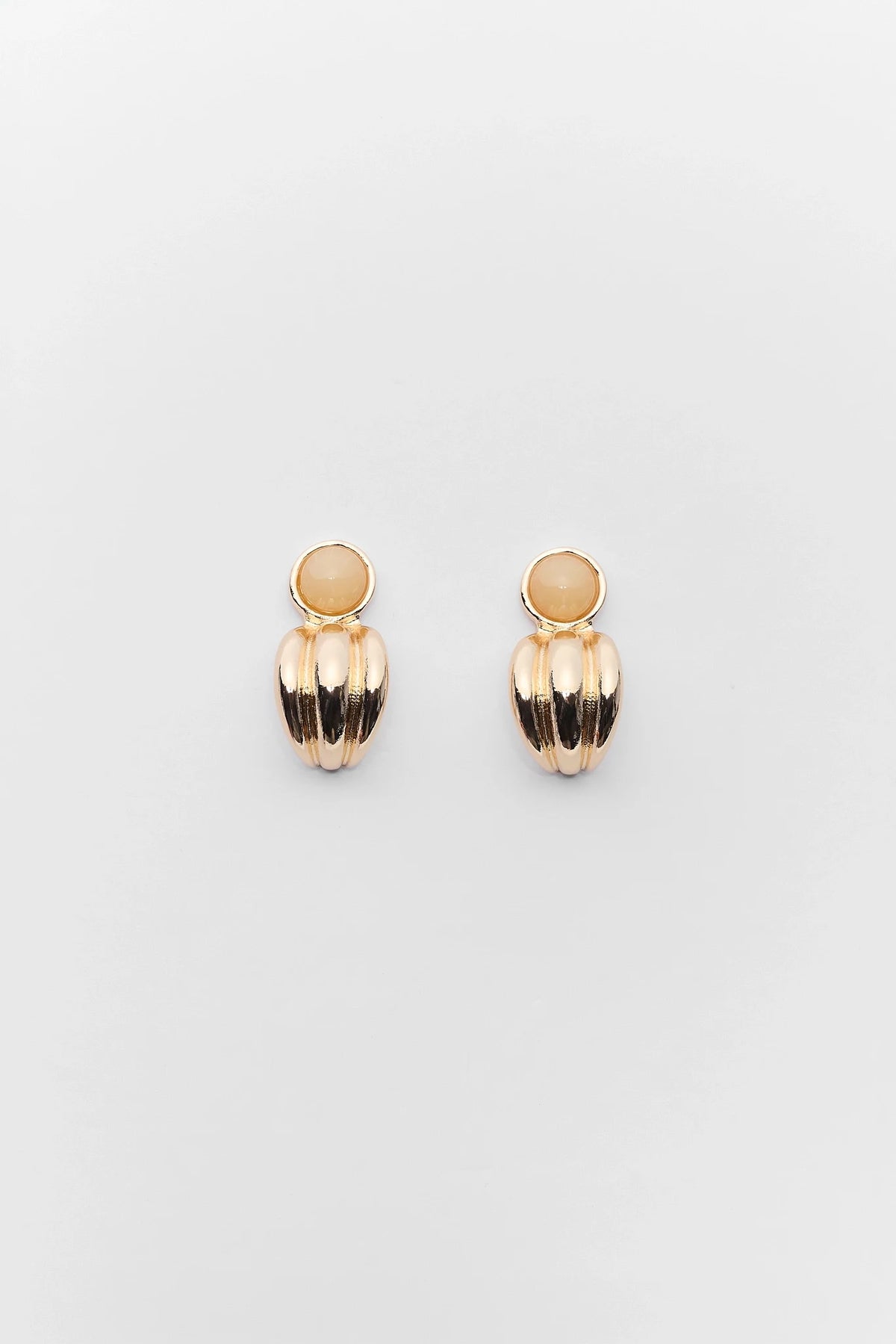 Gold fluted stud earrings with stone detail - Flat Lay | Avara